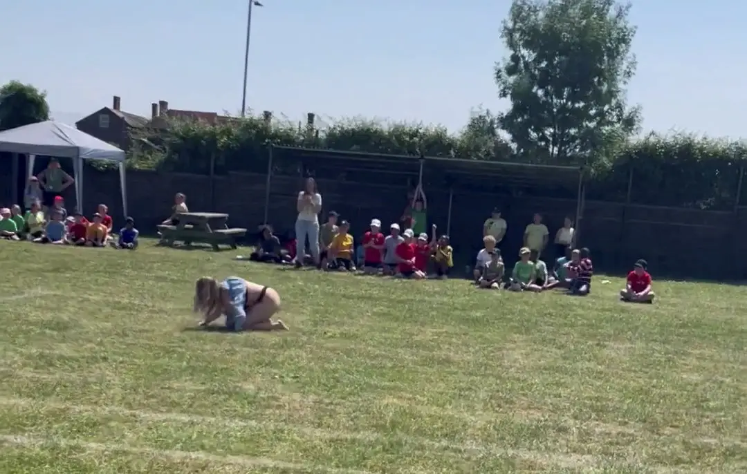 Katie's fall resulted in her dress being lifted above her head, revealing her underwear to the entire crowd.