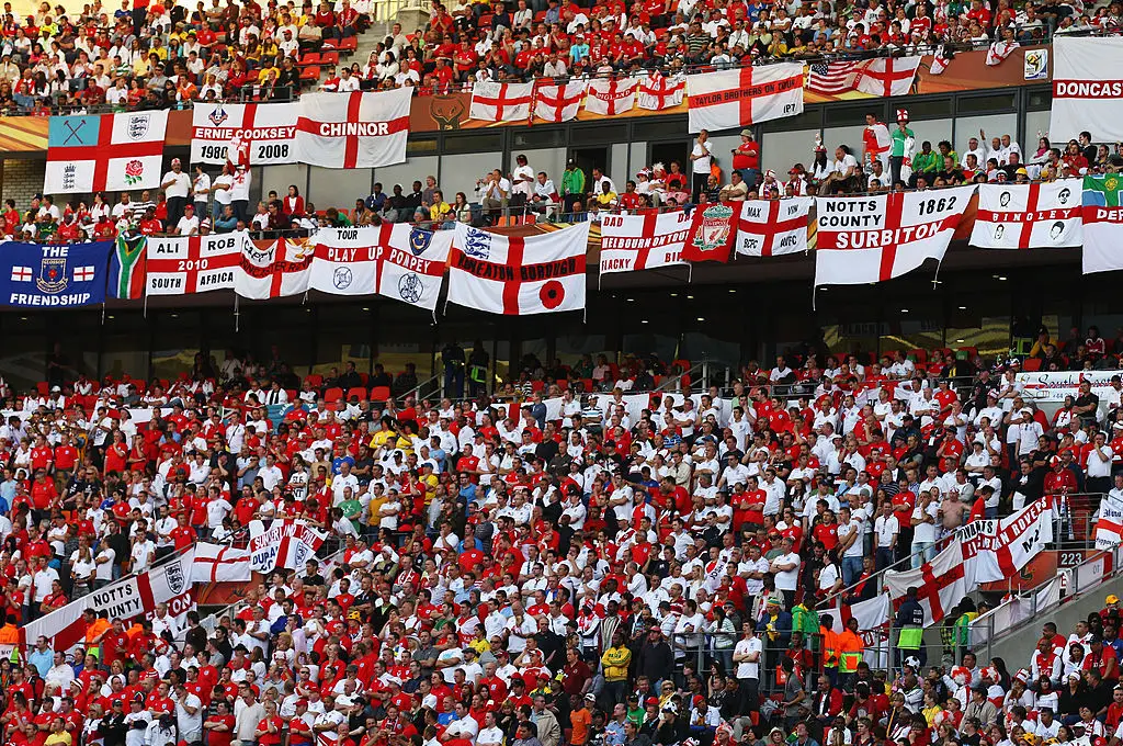 England fans like bringing flags with them to the World Cup, but they could be in trouble over some of them (Alex Livesey - FIFA/FIFA via Getty Images)