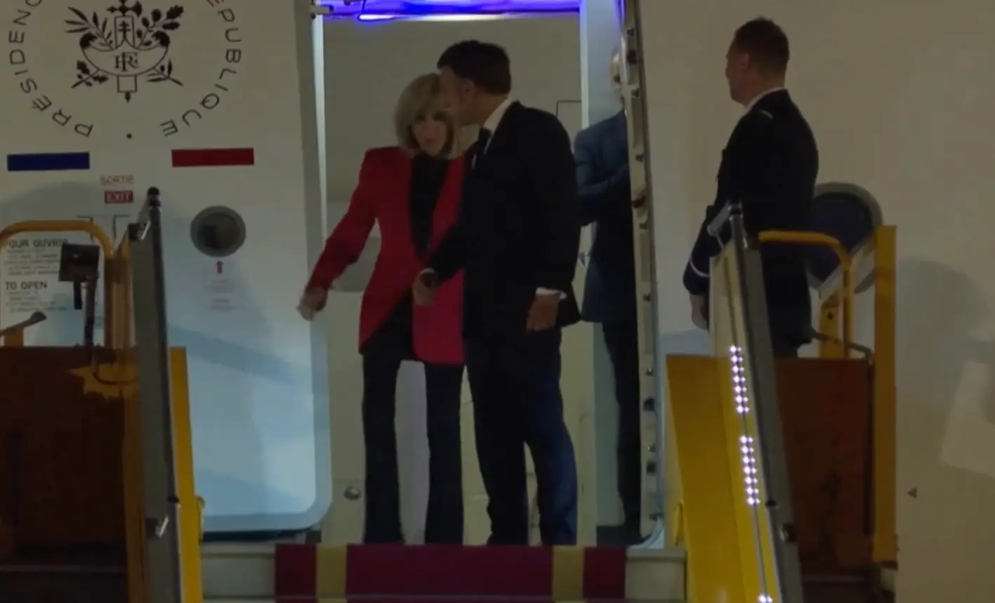 Brigitte appeared to then snub her husband as he offered her his arm to descend the aircraft steps (BBC)