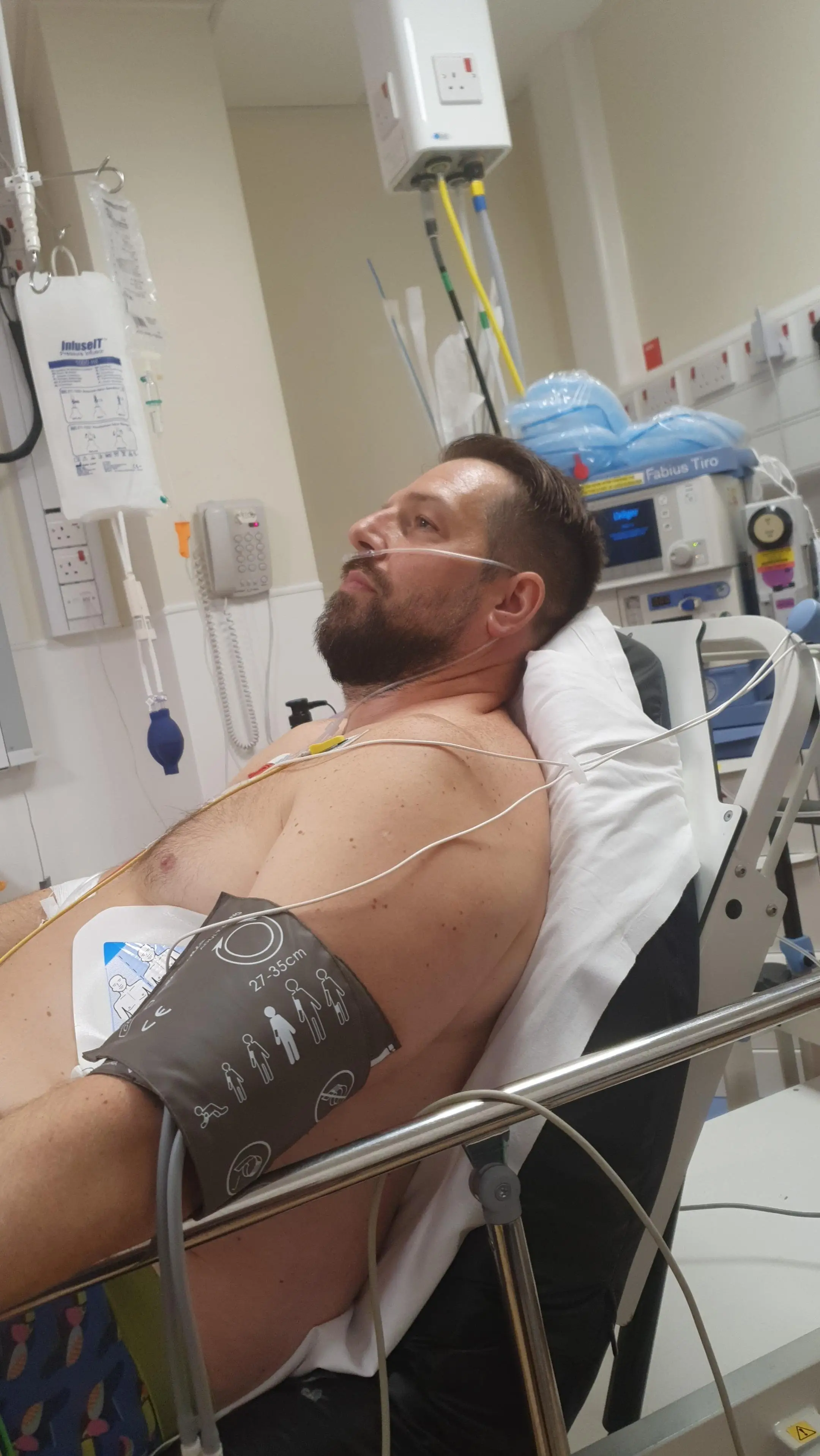 The dad says he is still living with the effects of his illness a year on (SWNS)