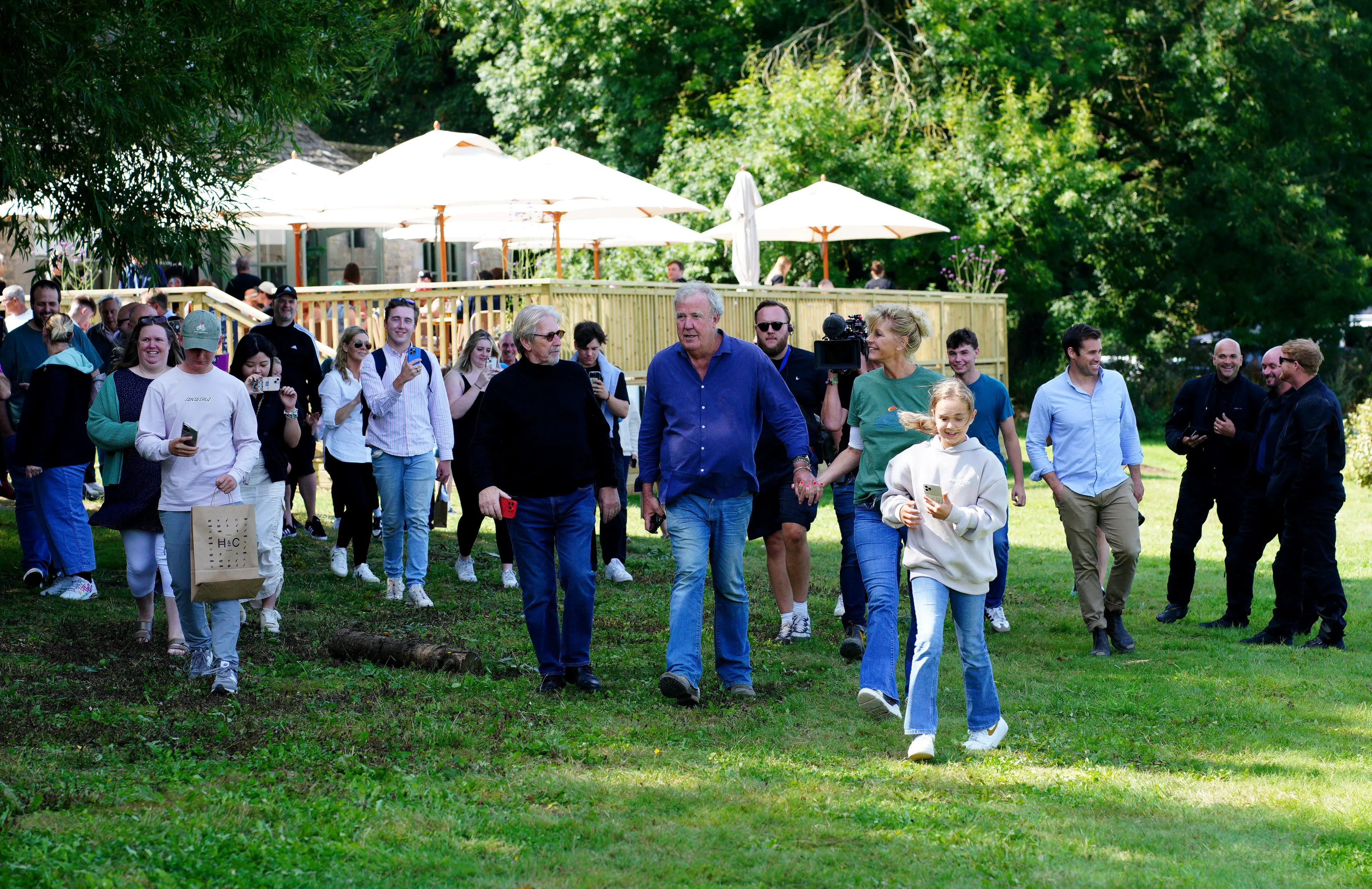 Jeremy Clarkson leading the crowds as he opens his pub to the public (Ben Birchall/PA Wire)