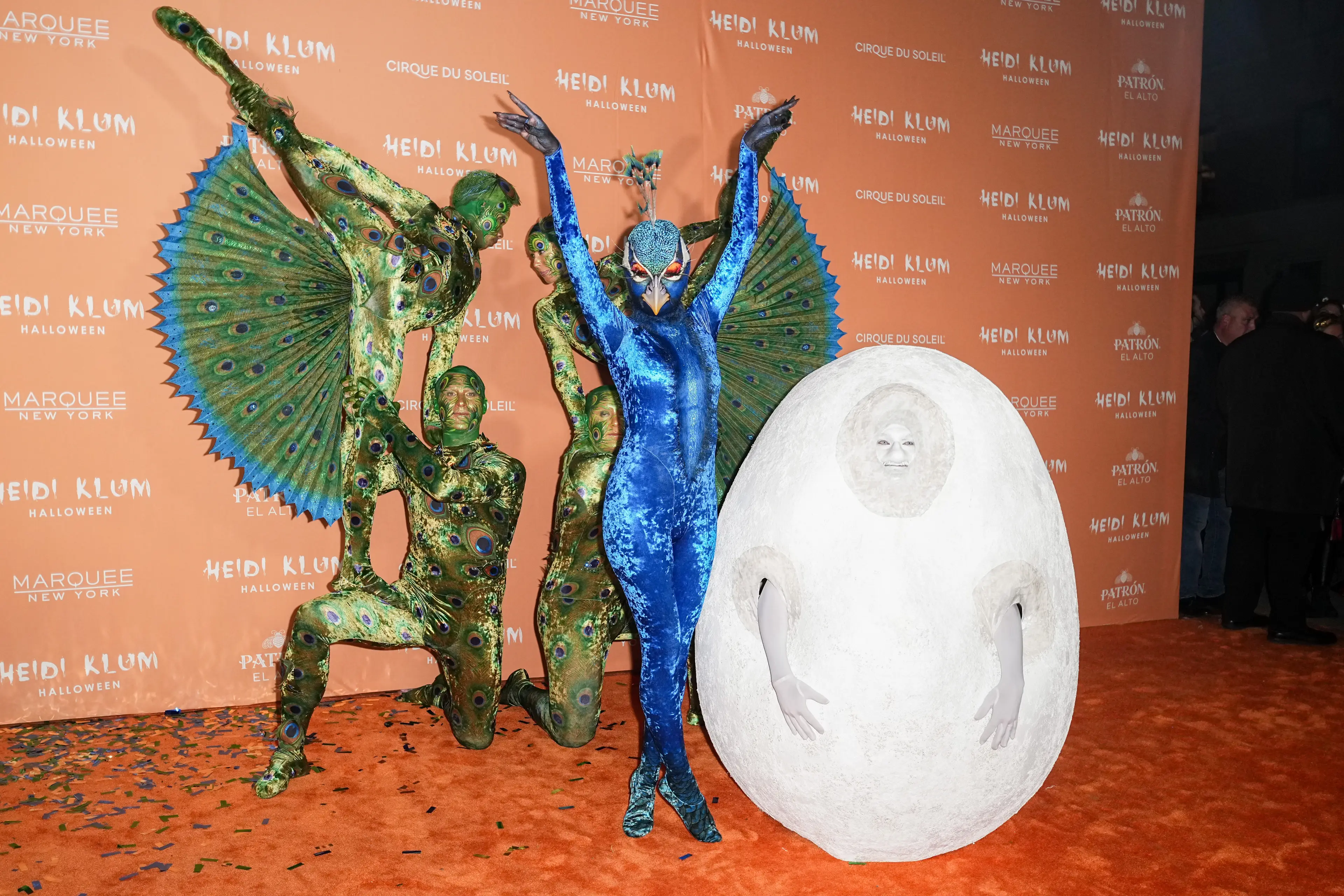 In 2023, Klum dressed as a peacock and her husband joined her as an egg (John Nacion/WWD via Getty Images)