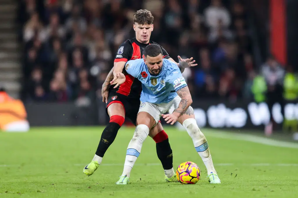 Bournemouth's Milos Kerkez battles for the ball with Man City's Kyle Walker (Image: Getty)