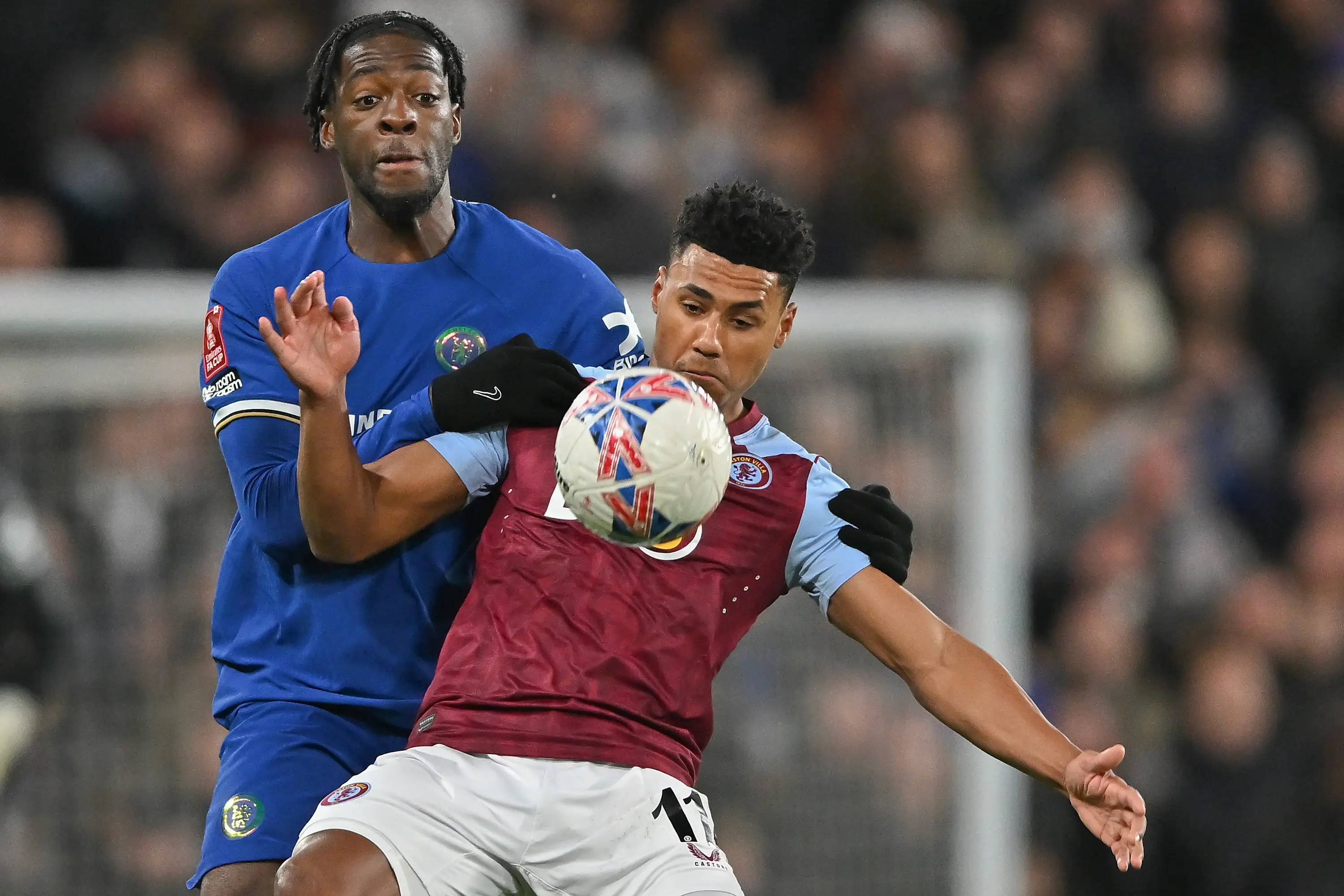 Axel Disasi and Ollie Watkins battle for the ball. (Image