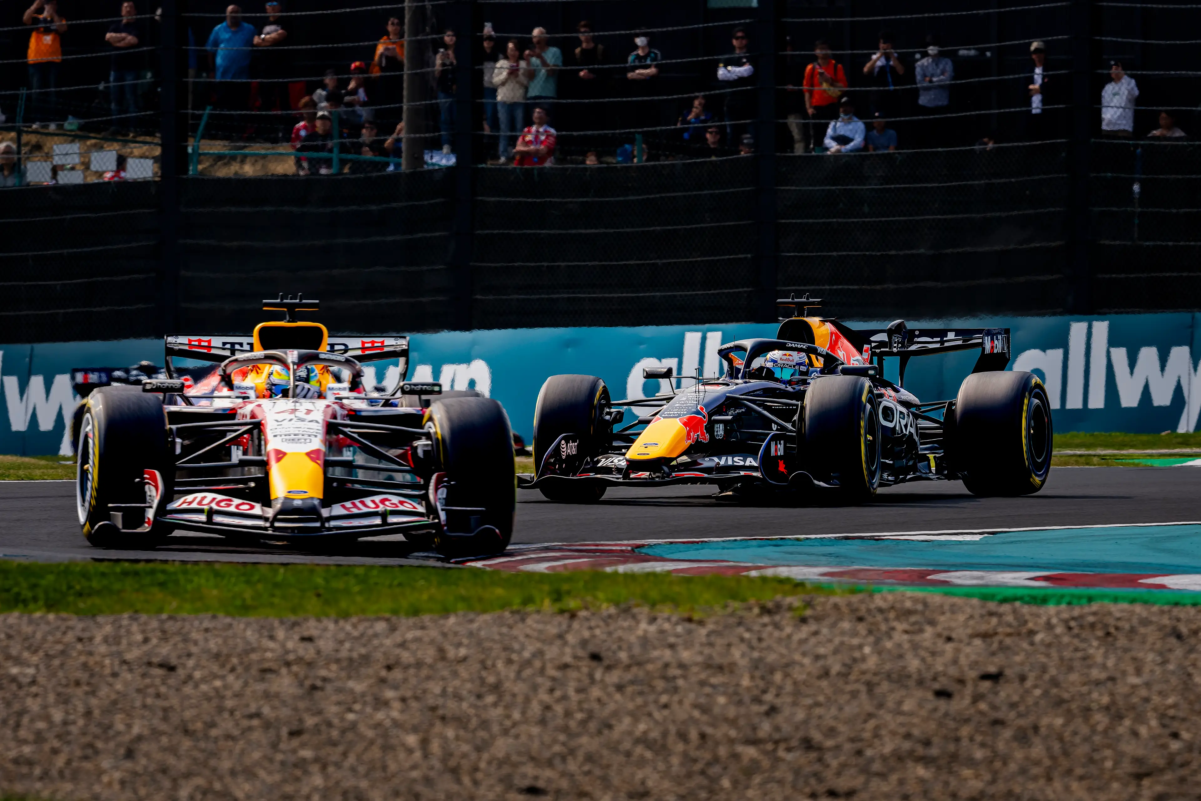 Max Verstappen battling Arvid Lindblad at Suzuka (credit: getty)