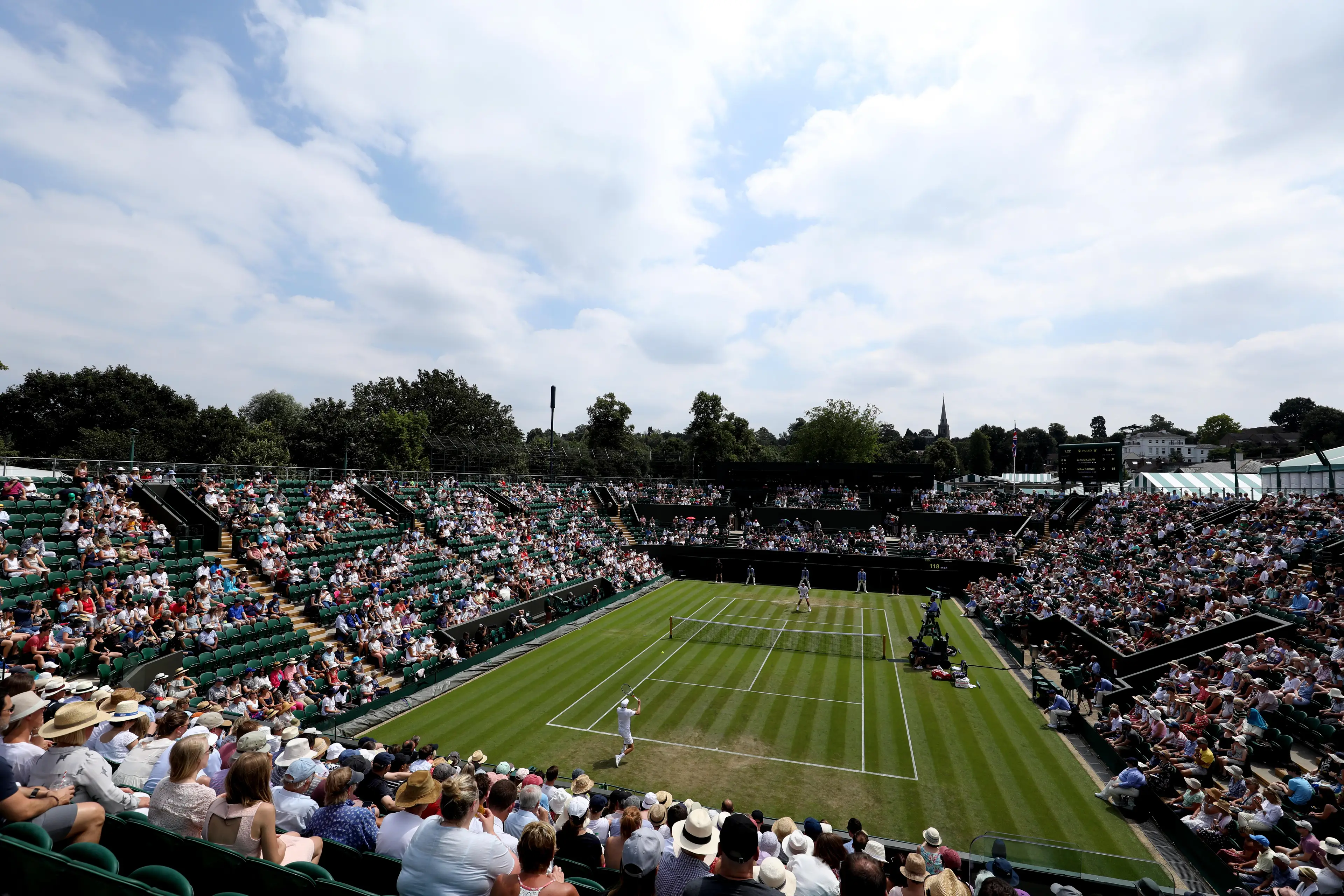 John Millman and Milos Raonic at Wimbledon.