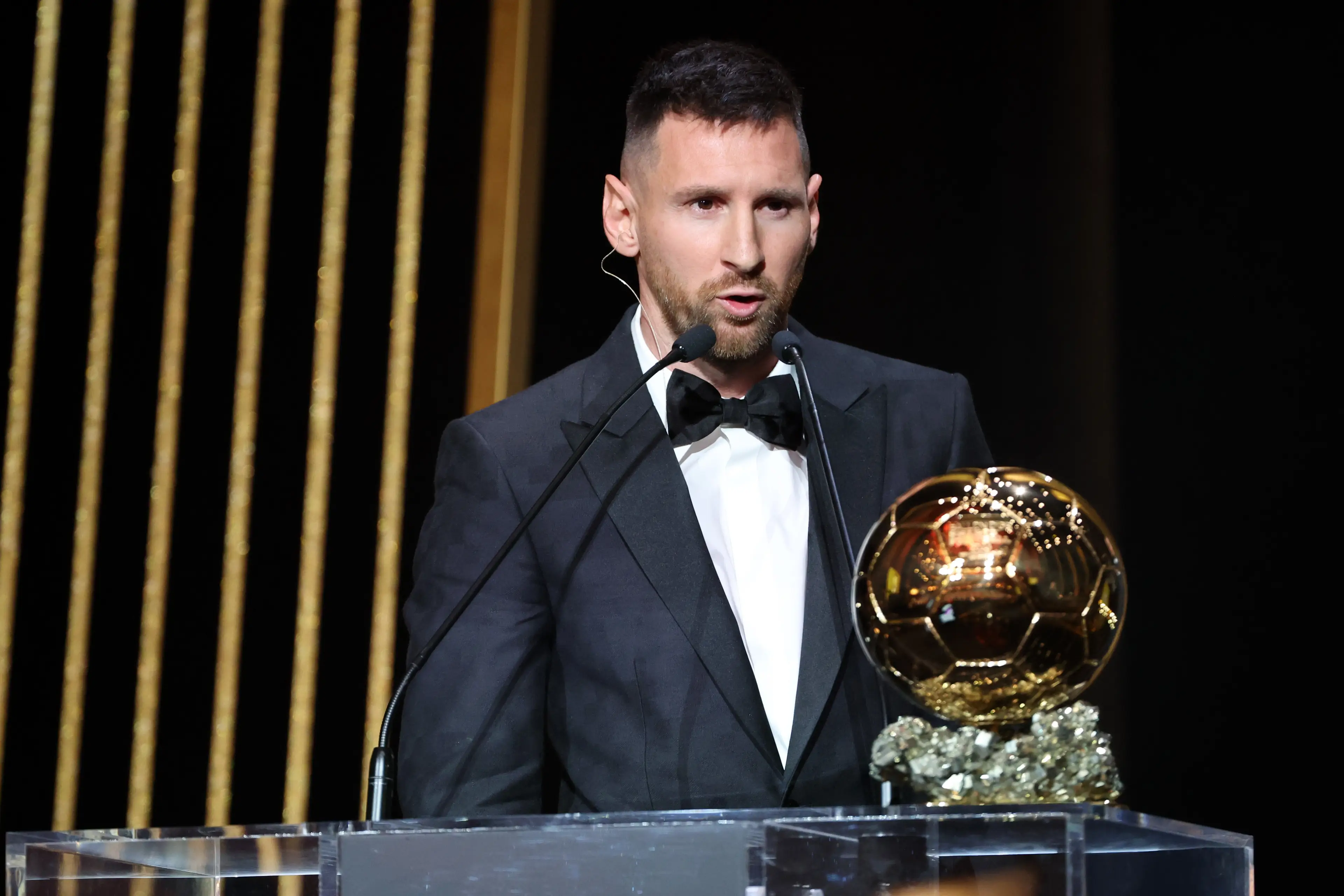 Lionel Messi on stage as he wins the Ballon d'Or award. Image: Getty