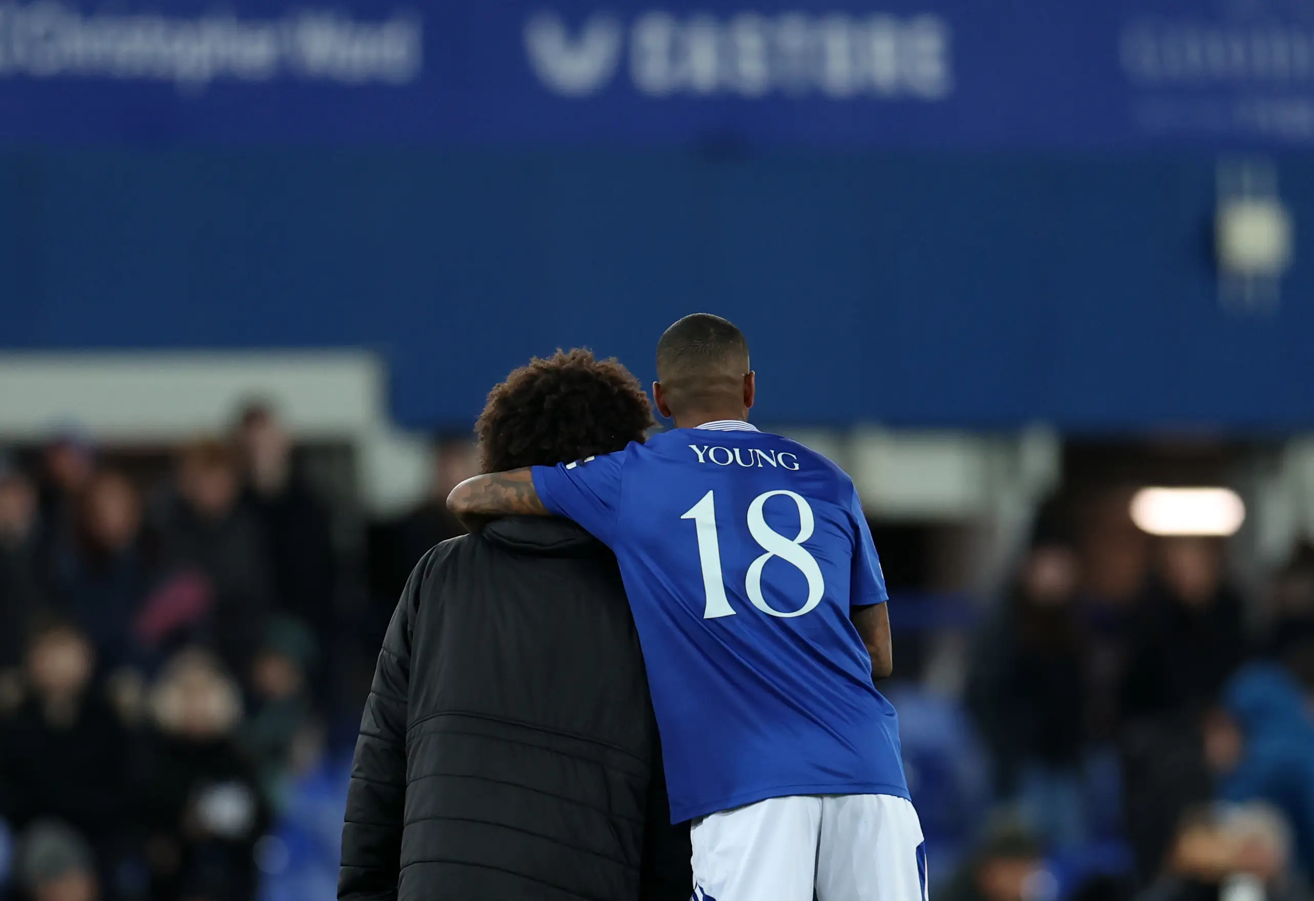 Ashley and Tyler Young embrace on the pitch. Image: Getty