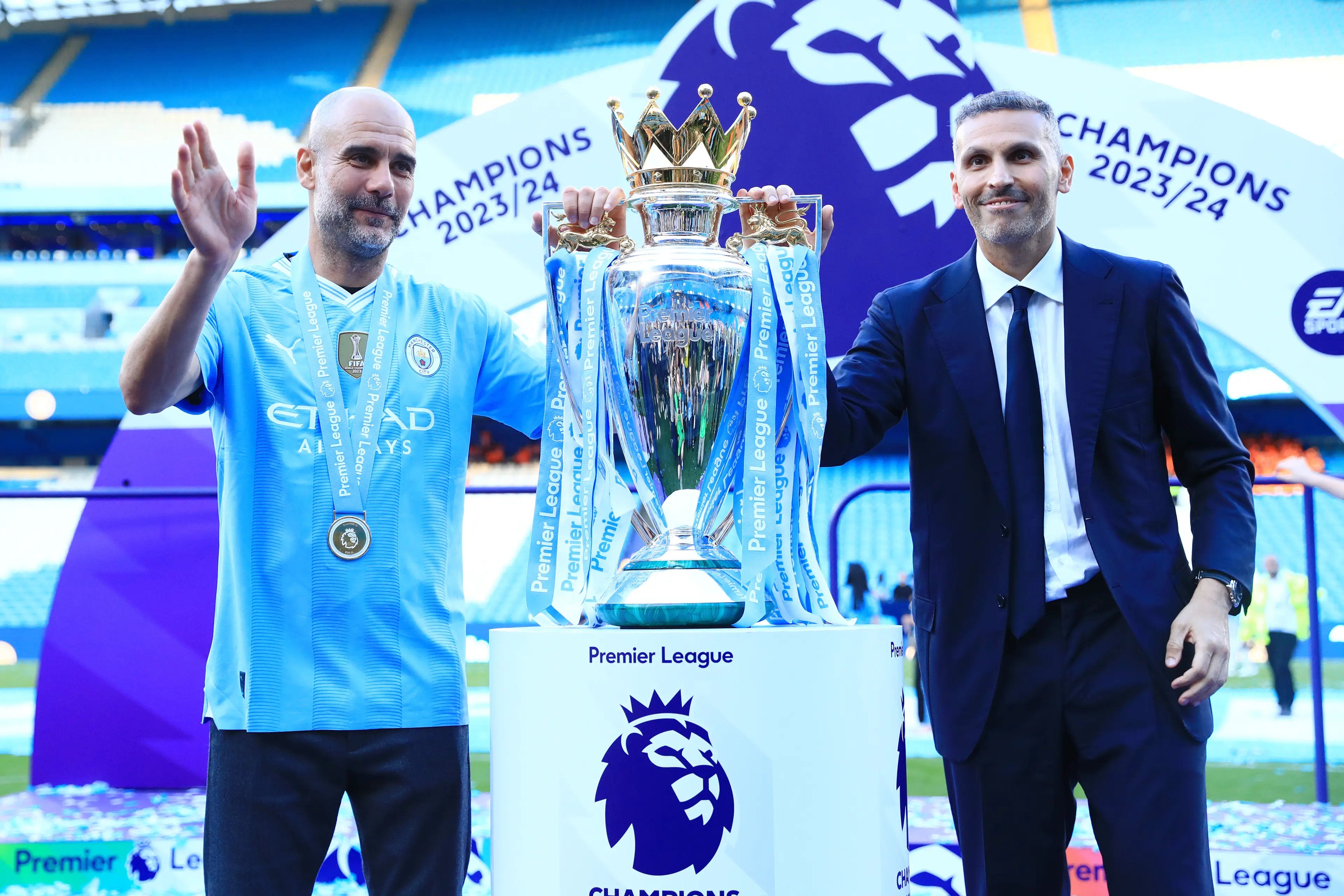 Pep Guardiola and Khaldoon Al Mubarak celebrate Manchester City's Premier League triumph. Image: Getty 