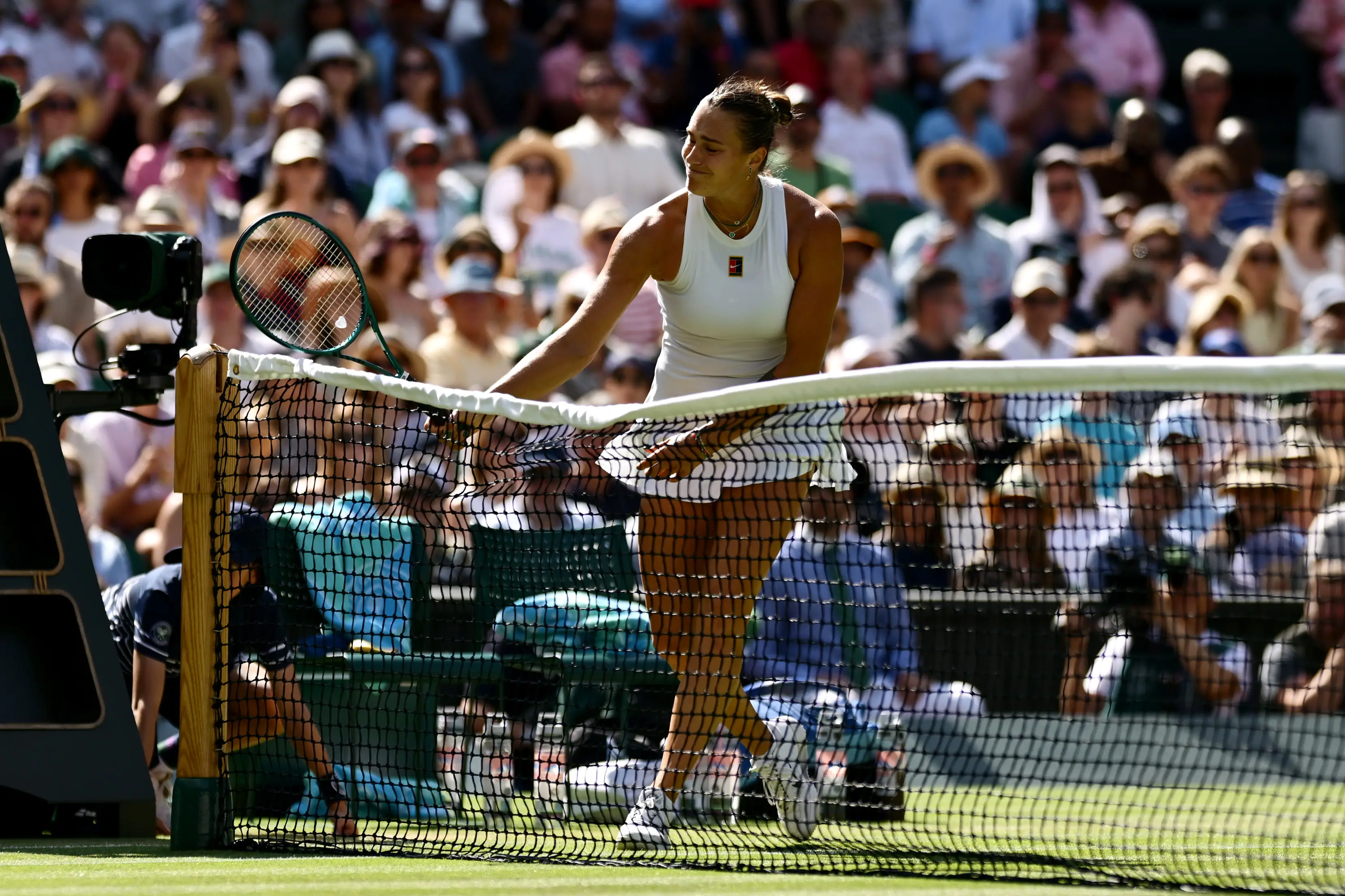 Sabalenka hits her racket on the net during her quarter-final match against Laura Siegemund. Image credit: Getty