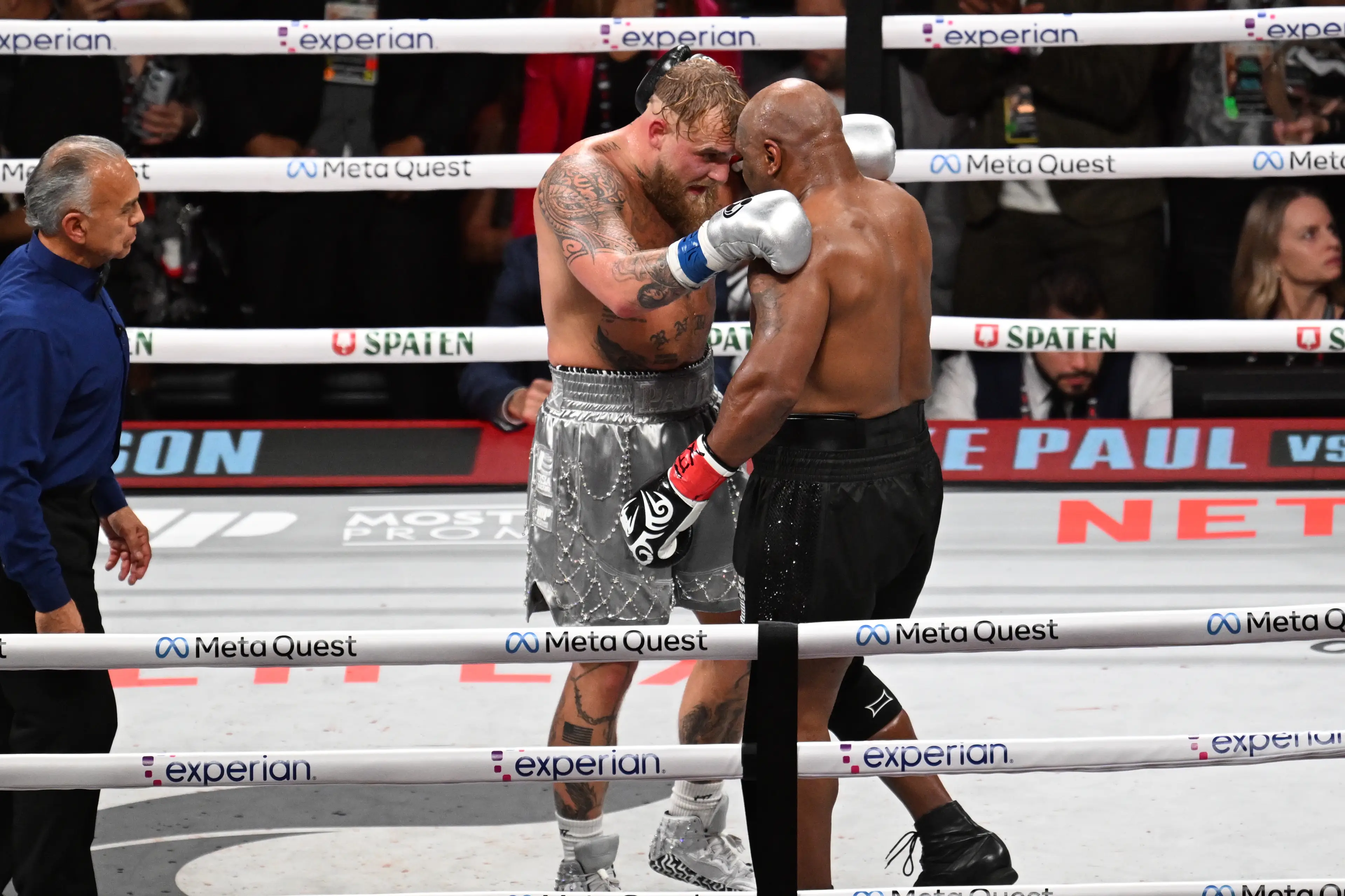 Jake Paul and Mike Tyson embrace after their fight in Texas. Image: Getty