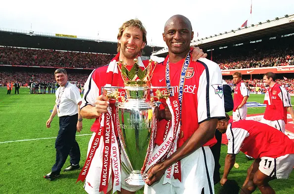 Adams (pictured alongside Patrick Vieira) won his fourth and final top division title in 2002 (Image: Getty)