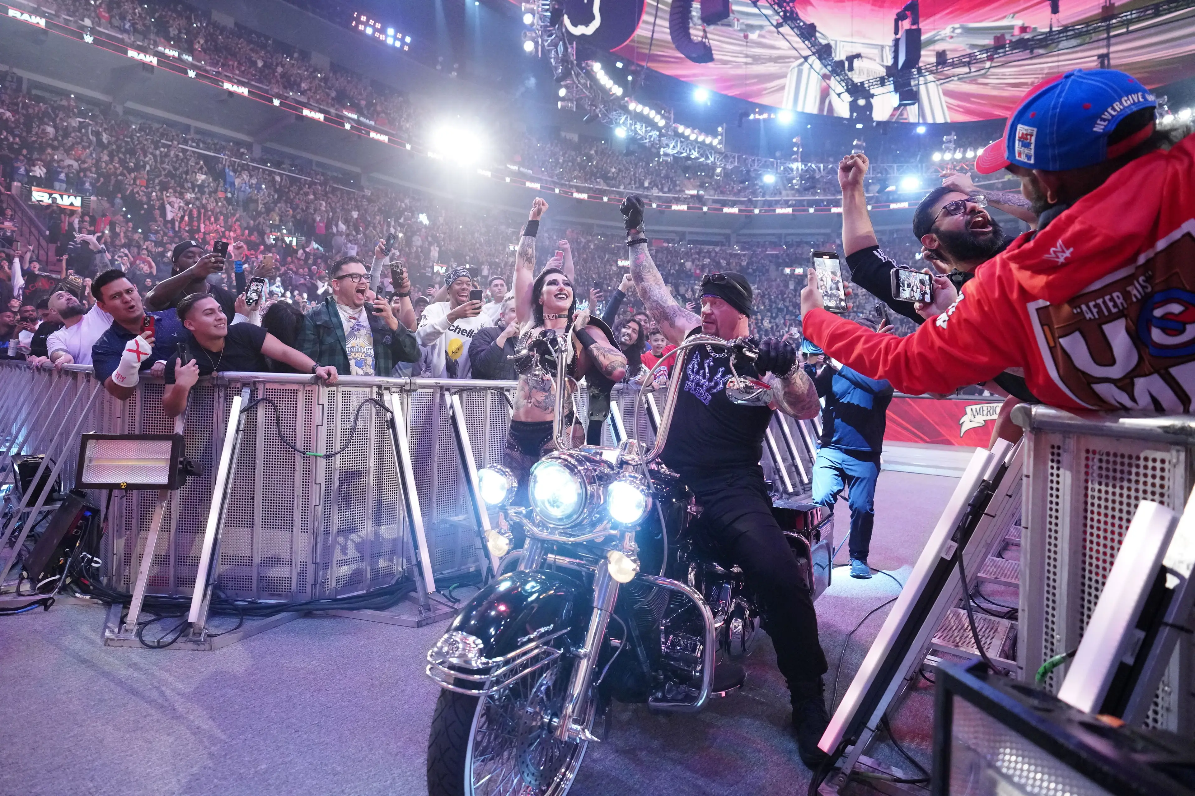 Rhea Ripley celebrated her women's world title win with The Undertaker. Image: Getty