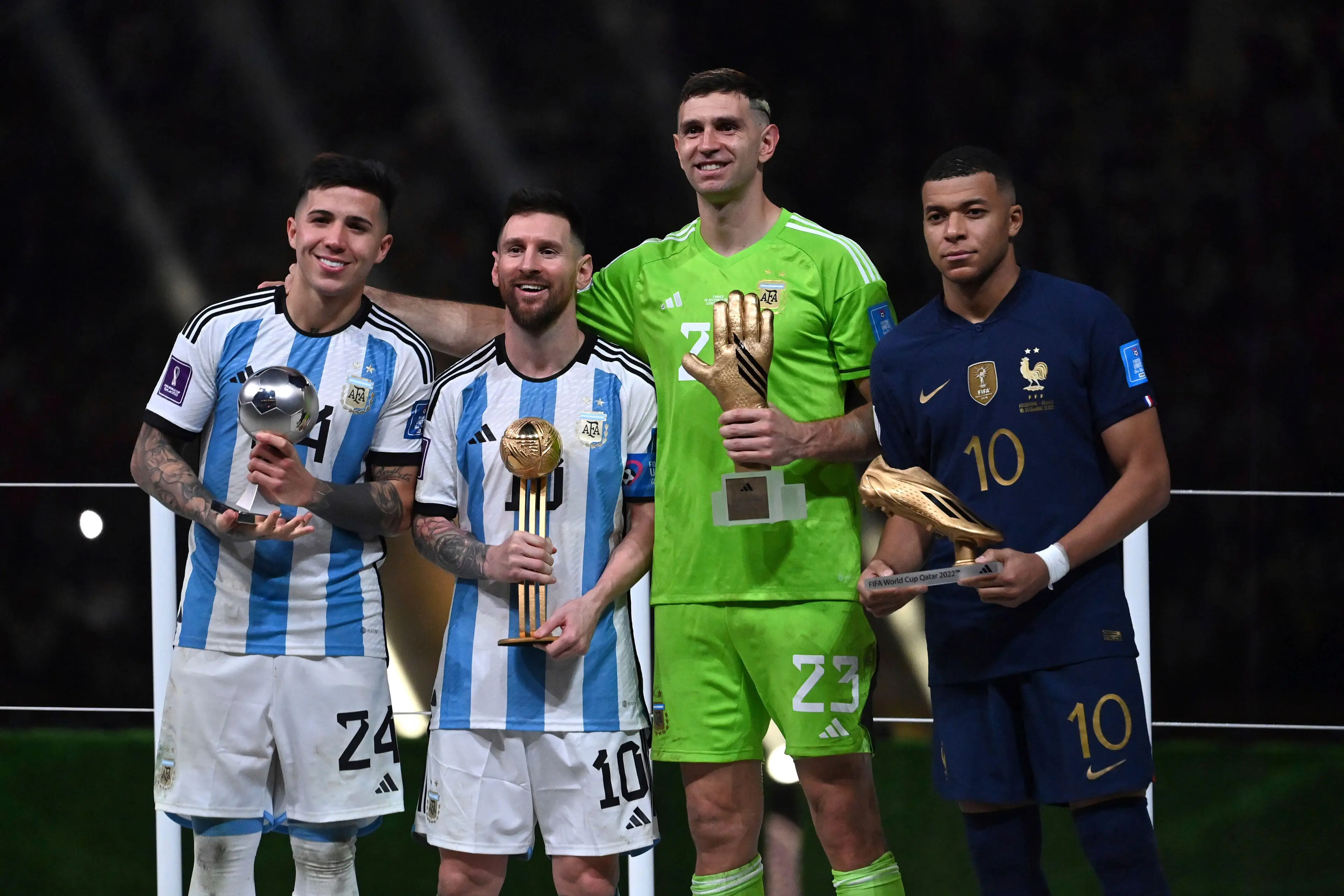 Emiliano Martinez lines up alongside Kylian Mbappe during the awards presentation. Image: Alamy