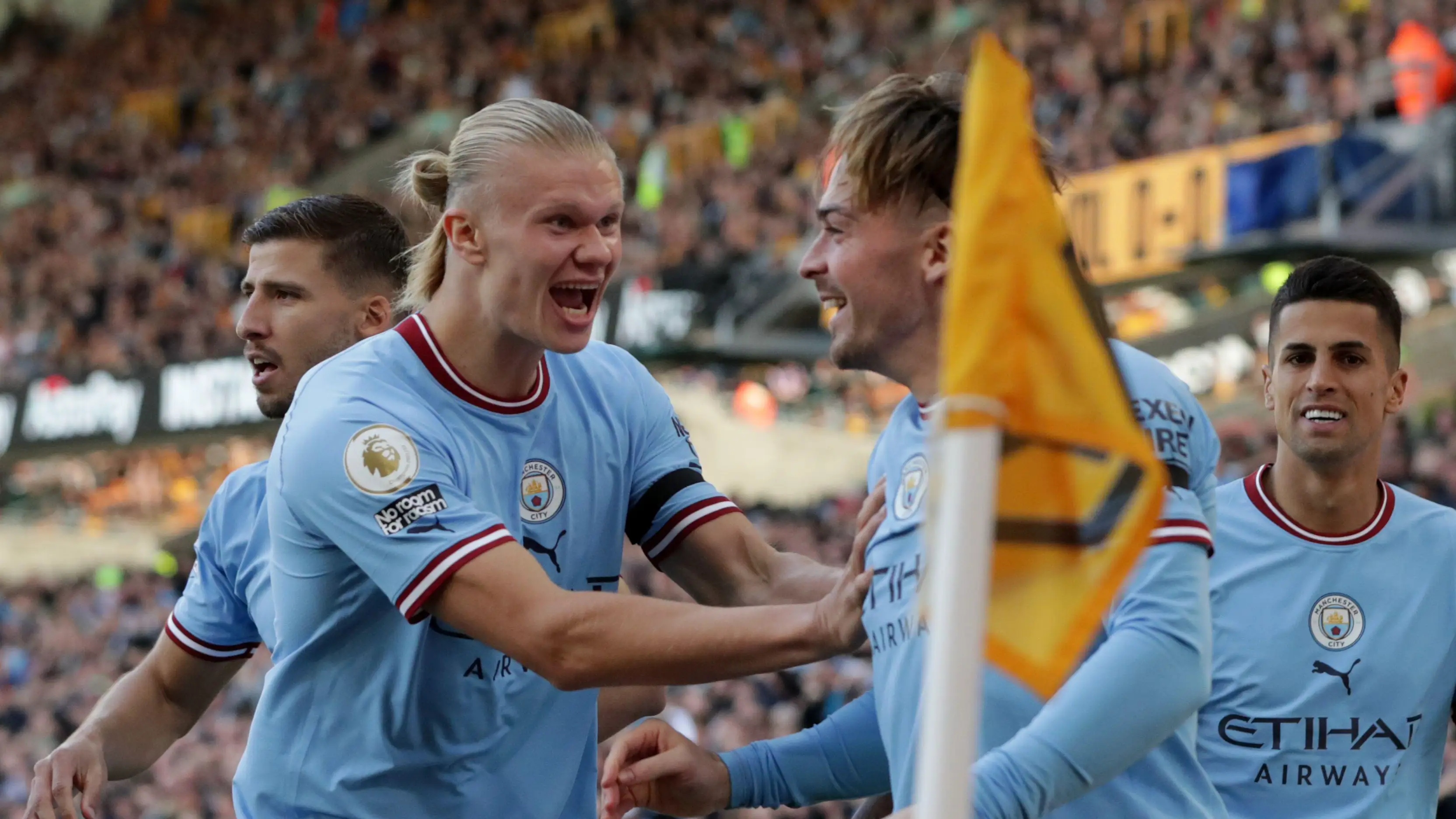 Erling Haaland celebrates with Jack Grealish.