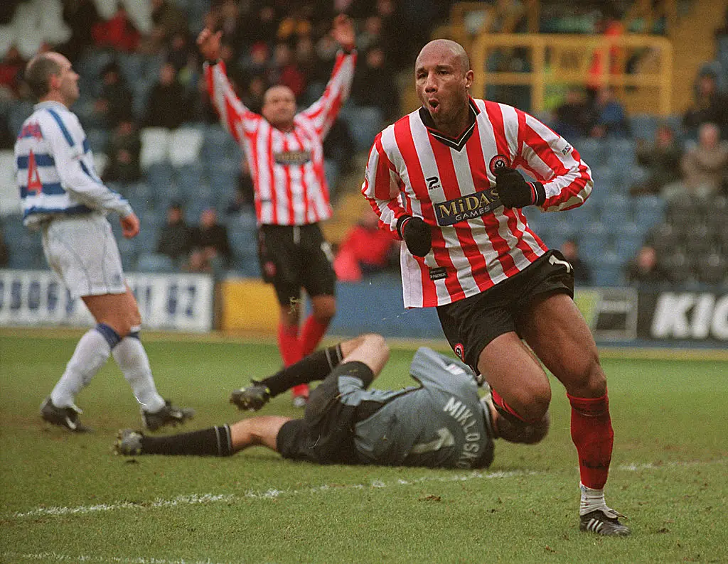 George Santos got his revenge on Andy Johnson during the match. (Image: Chris Lobina/ALLSPORT)