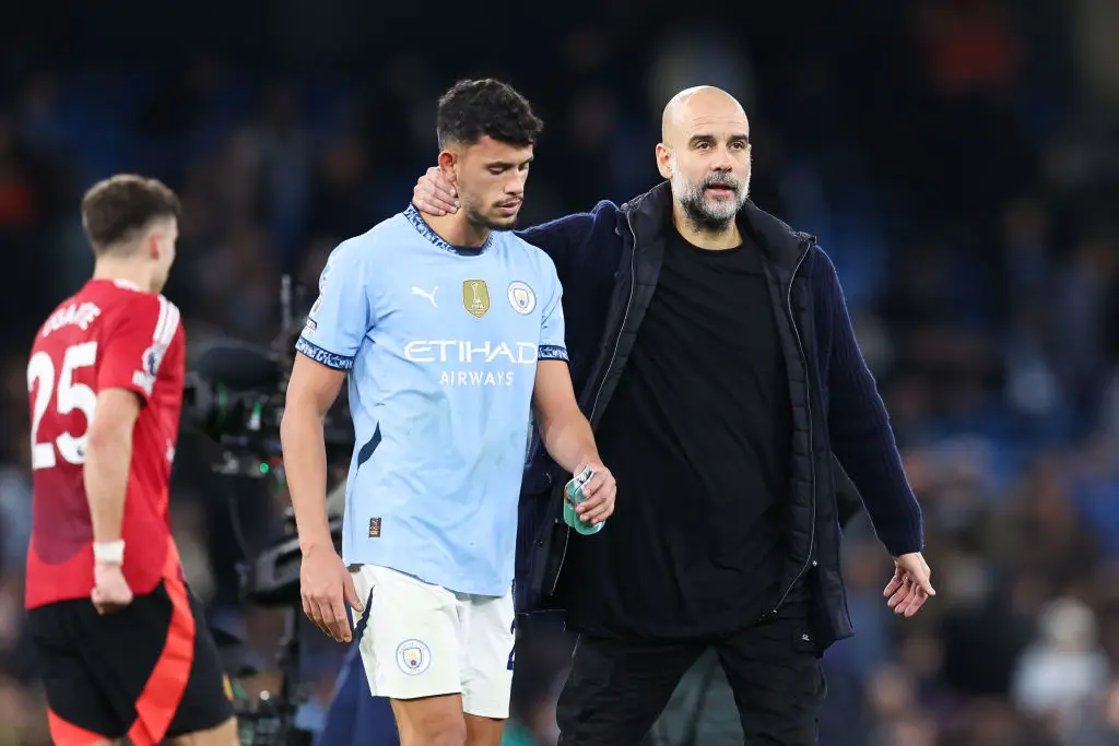 Pep Guardiola consoles Matheus Nunes after Man City's 2-1 defeat to Man Utd (Image: Getty)