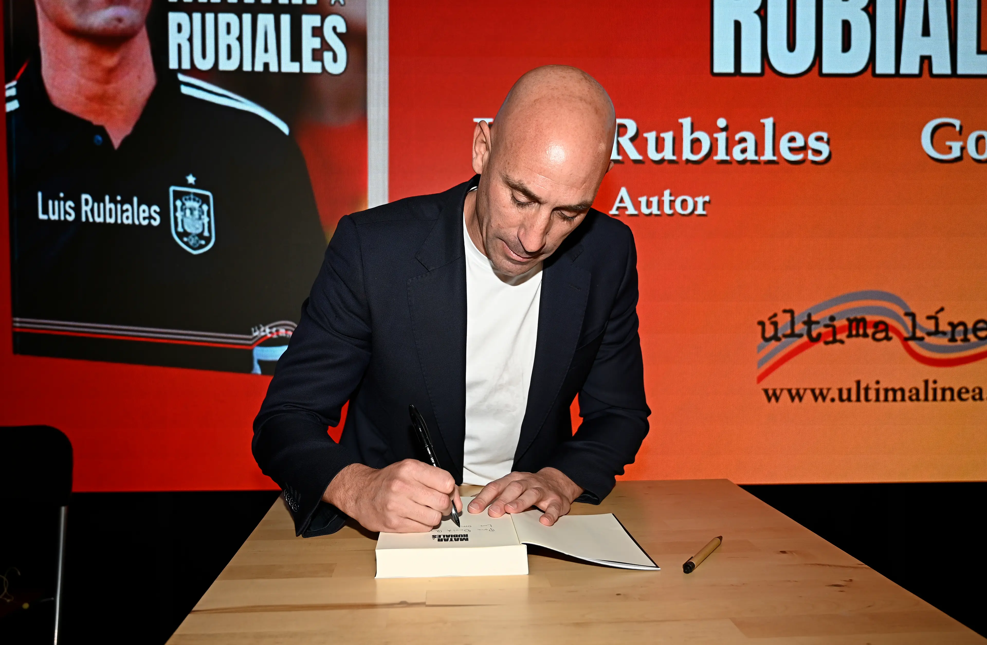 Luis Rubiales signing copies of his book. (Image: Getty)