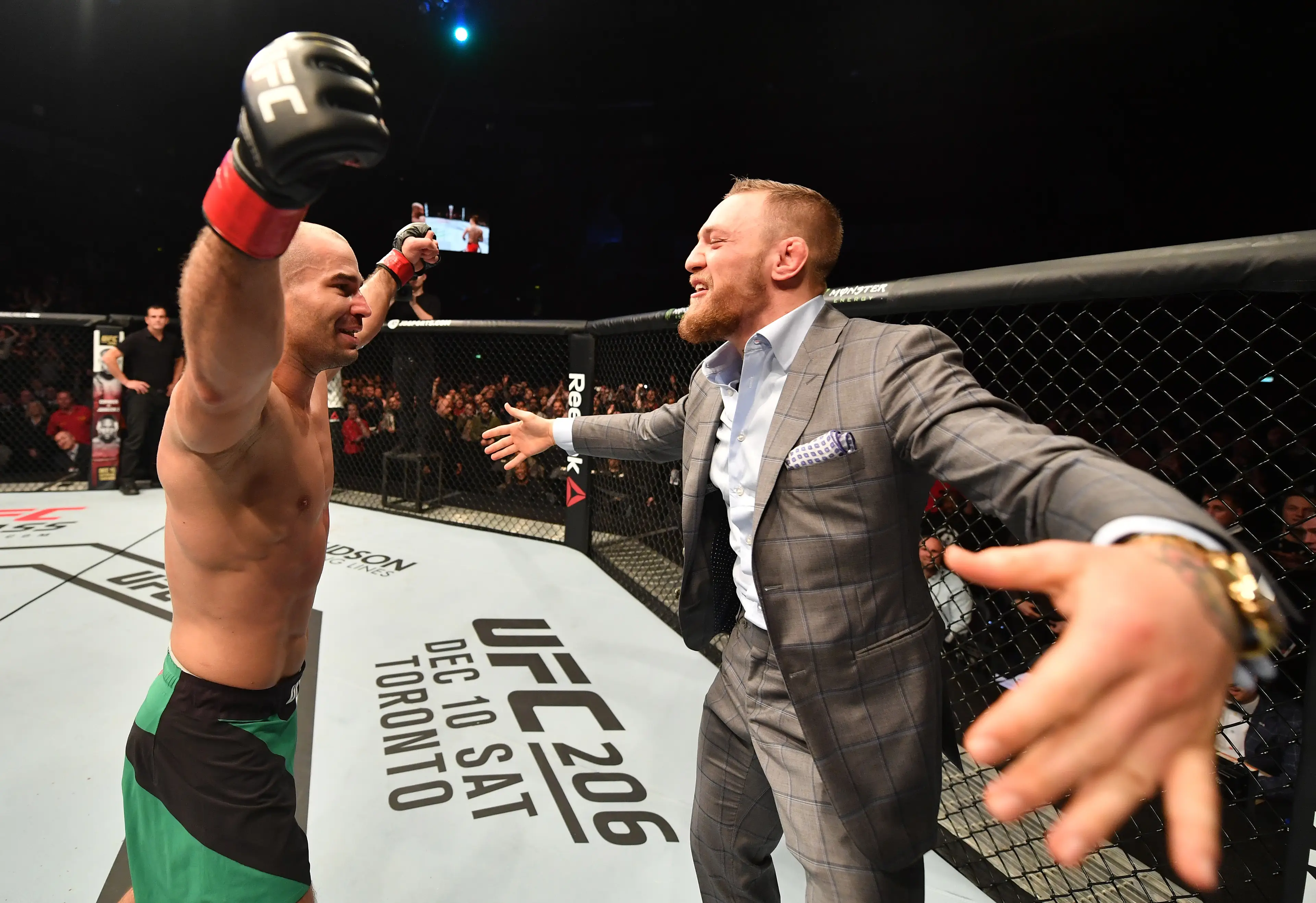 Artem Lobov celebrates with Conor McGregor following his victory at UFC Belfast. Image: Getty 