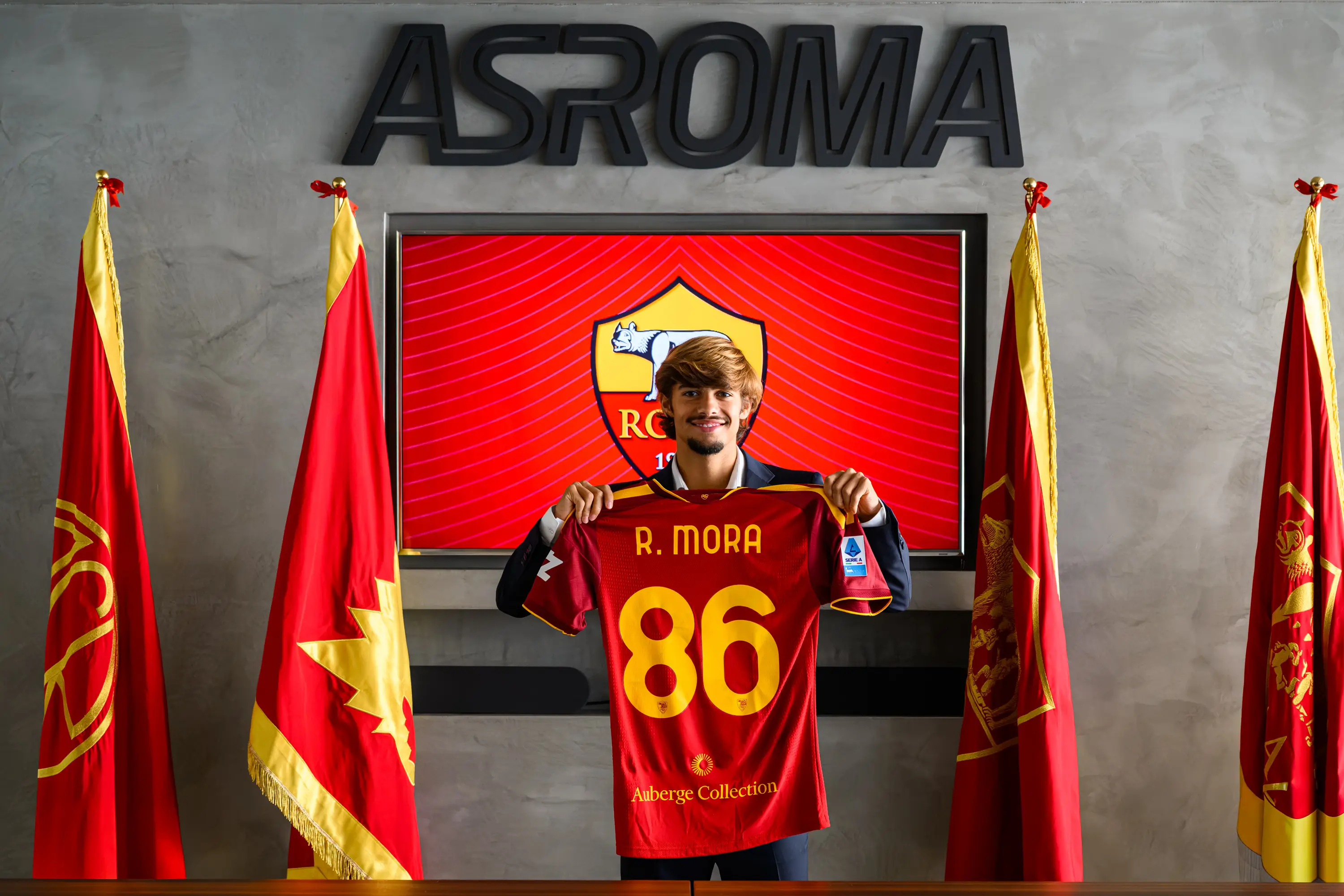 Rodrigo Mora holds up the number 86 shirt. Image credit: Getty