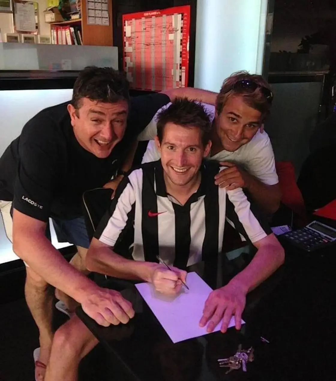 Mick and Louis make their first signing for Bruno's Magpies. Image credit: Louis Perry