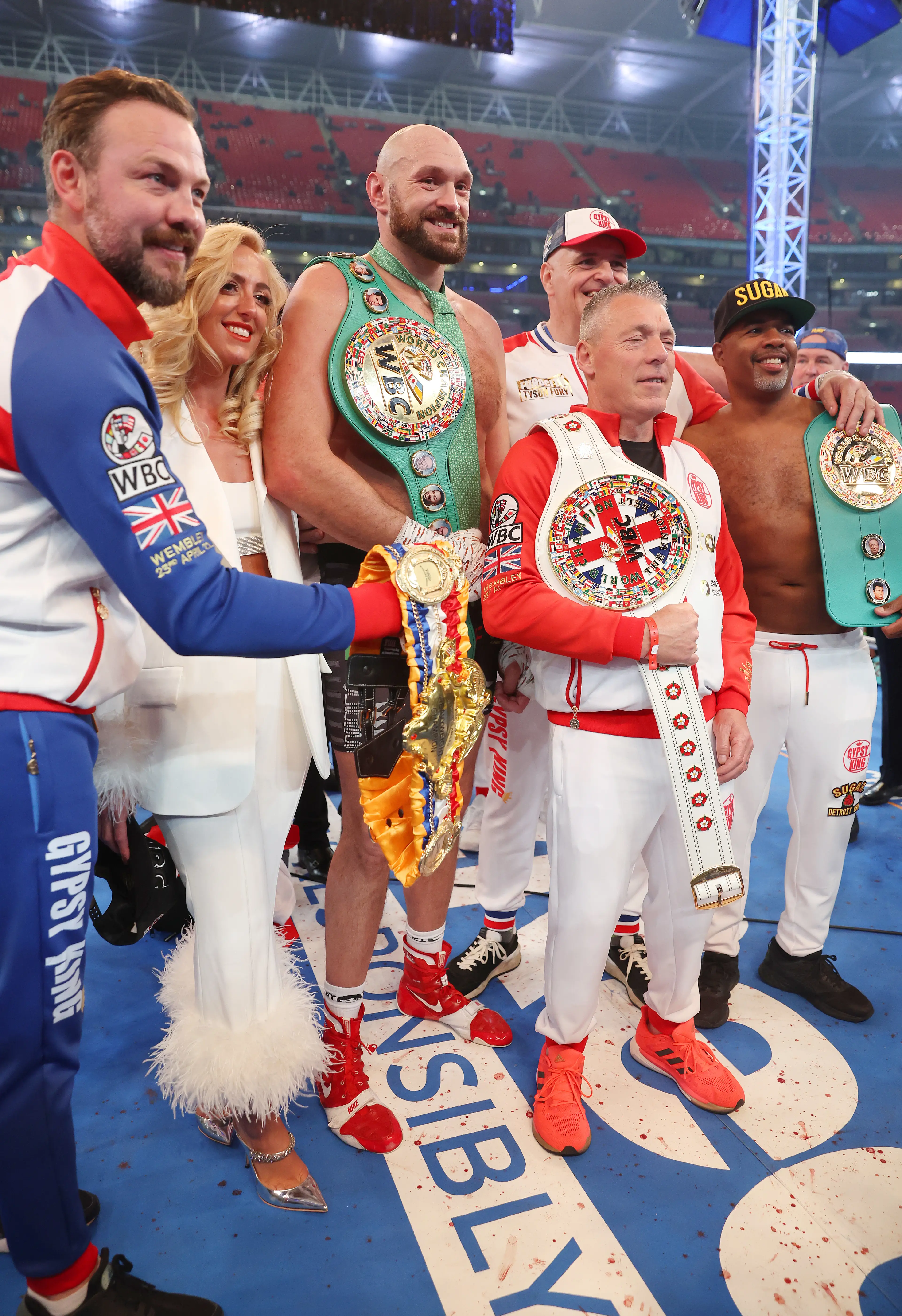 Tyson Fury with Paris Fury and John Fury after his win against Dillian Whyte. Image: Getty