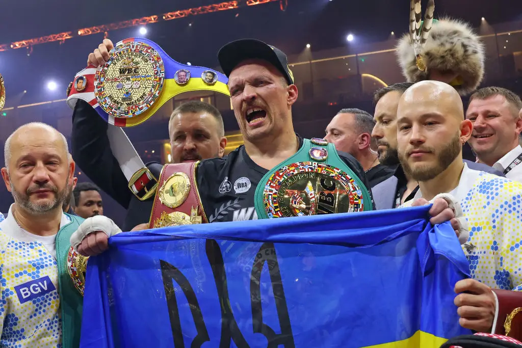 Oleksandr Usyk celebrates after beating Tyson Fury by split decision in Riyadh, Saudi Arabia (
