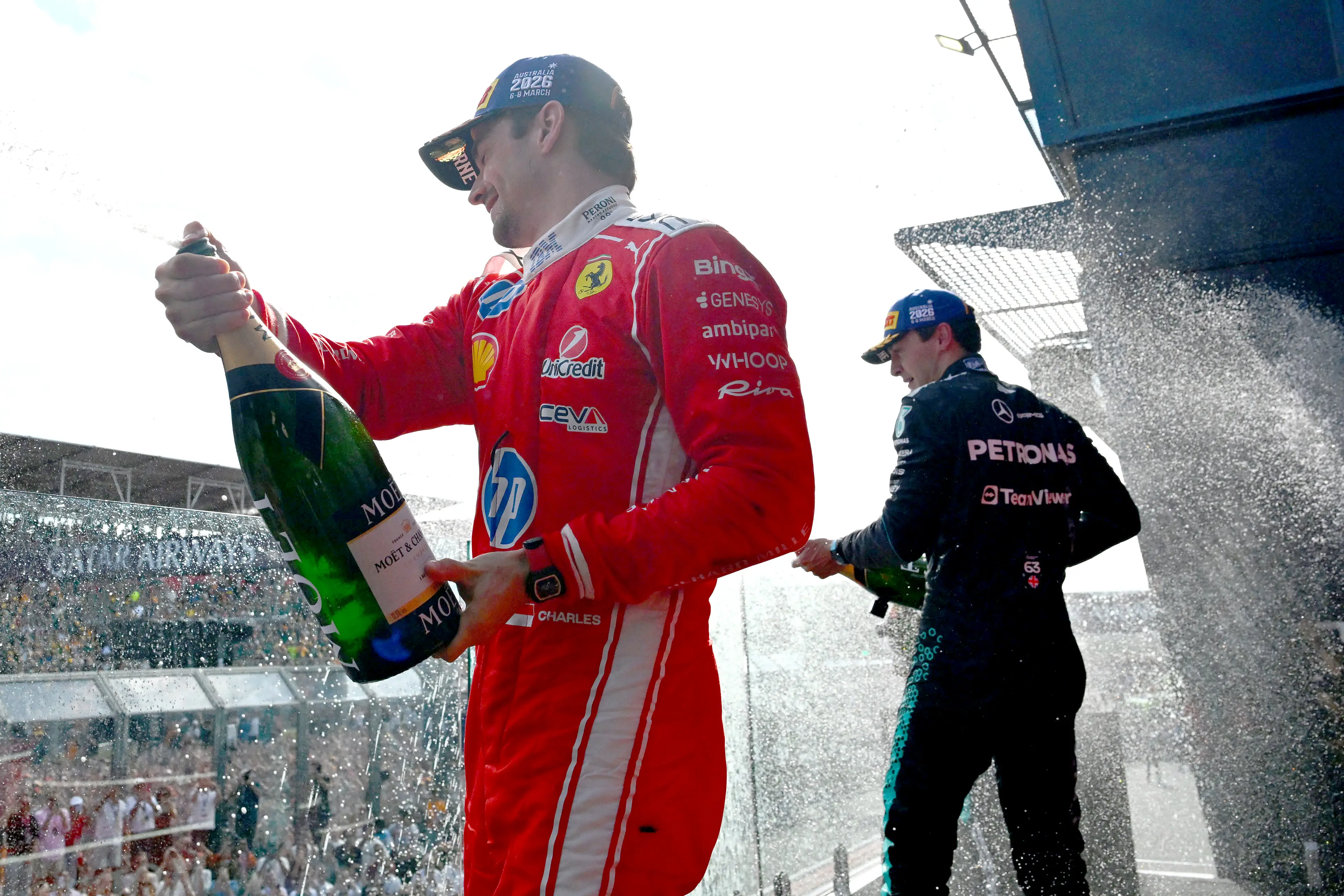 Charles Leclerc and George Russell on the podium (credit: getty)
