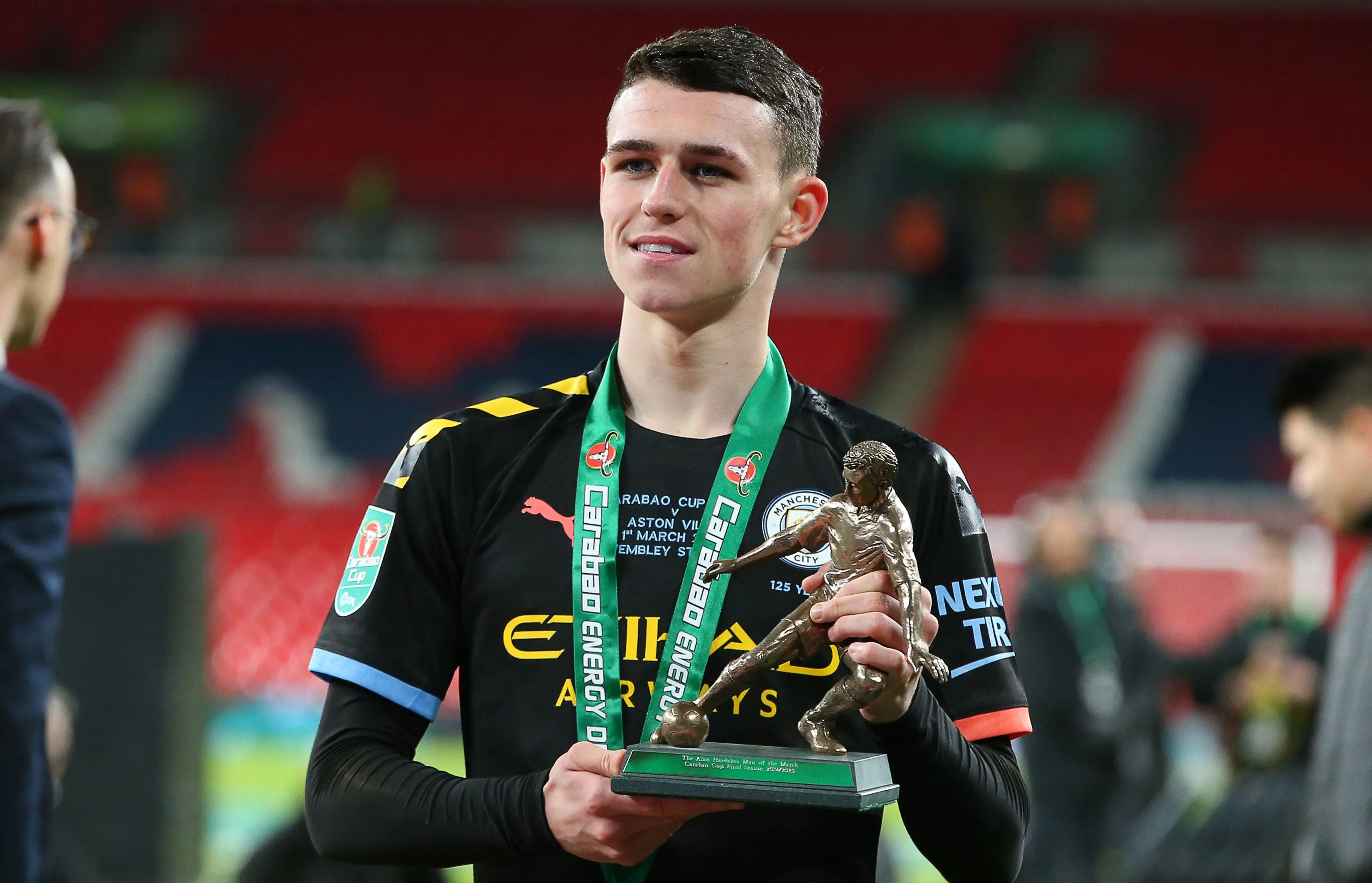 Phil Foden with the Man of the Match trophy (Sportimage / Alamy)