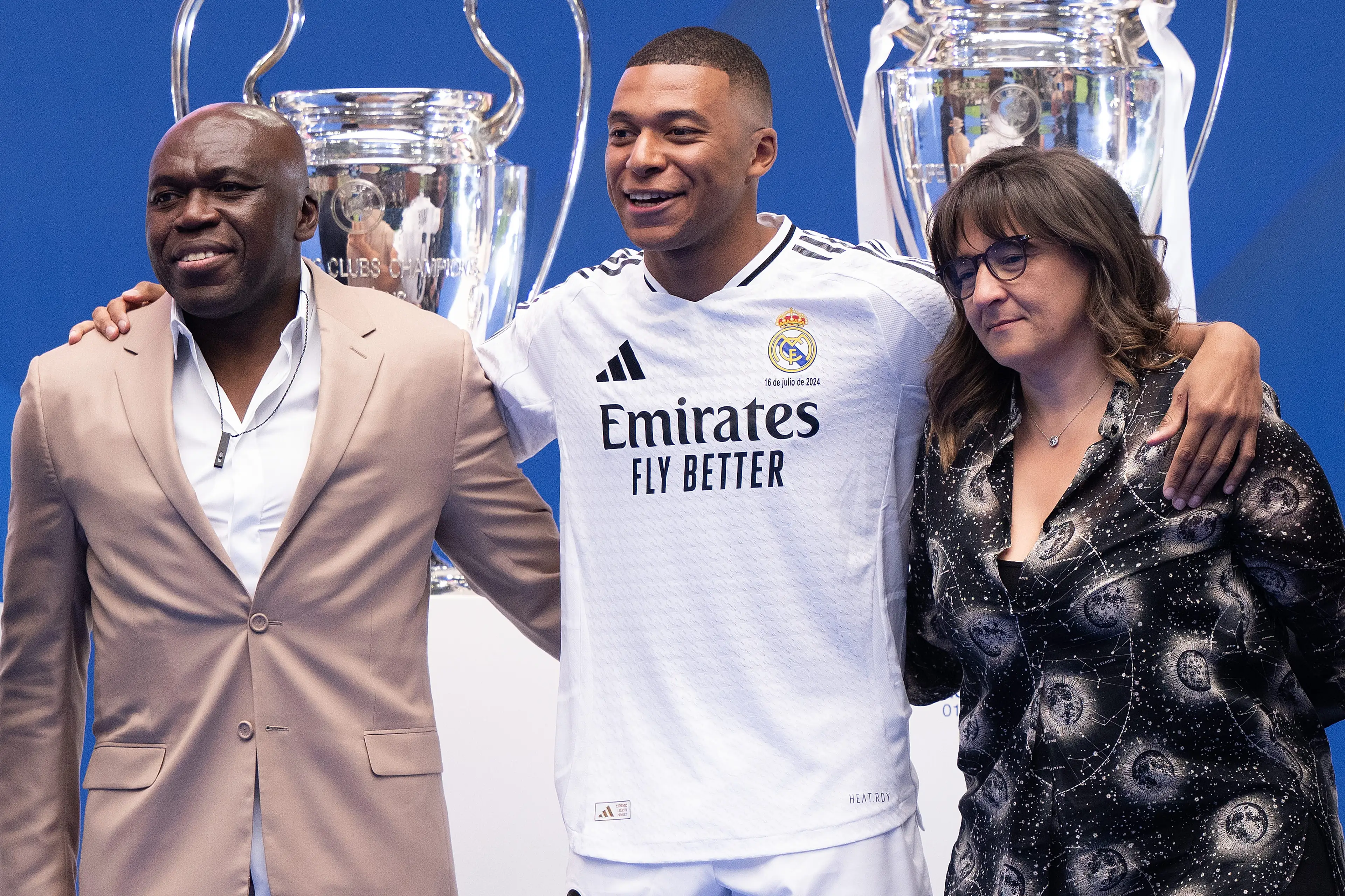 Kylian Mbappe, his father Wilfried Mbappe, and mother Fayza Lamari pictured (Image: Getty)
