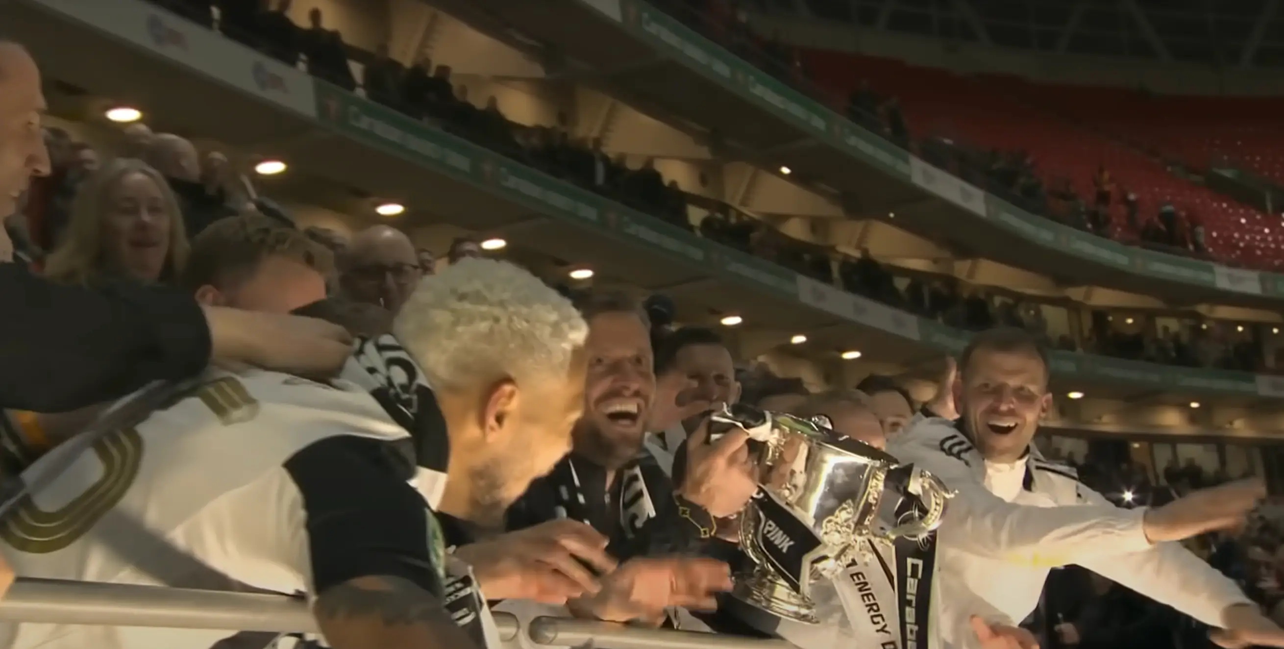 Jason Tindall lifts the Carabao Cup (Image: EFL)