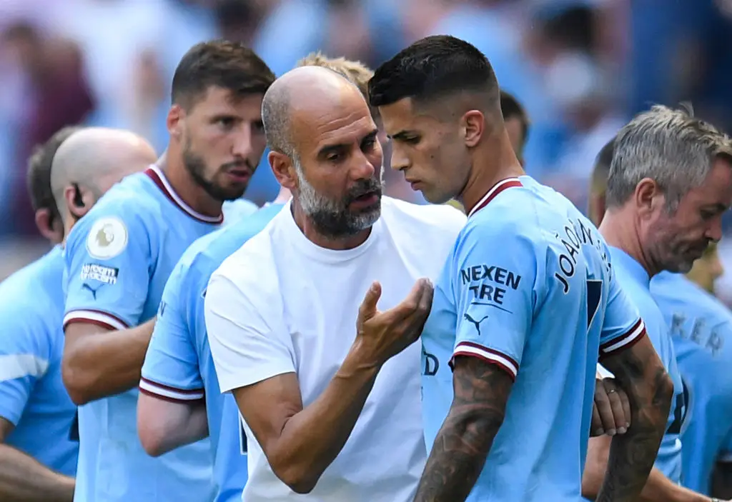 Man City manager Pep Guardiola and former player Joao Cancelo pictured (Image: Getty)