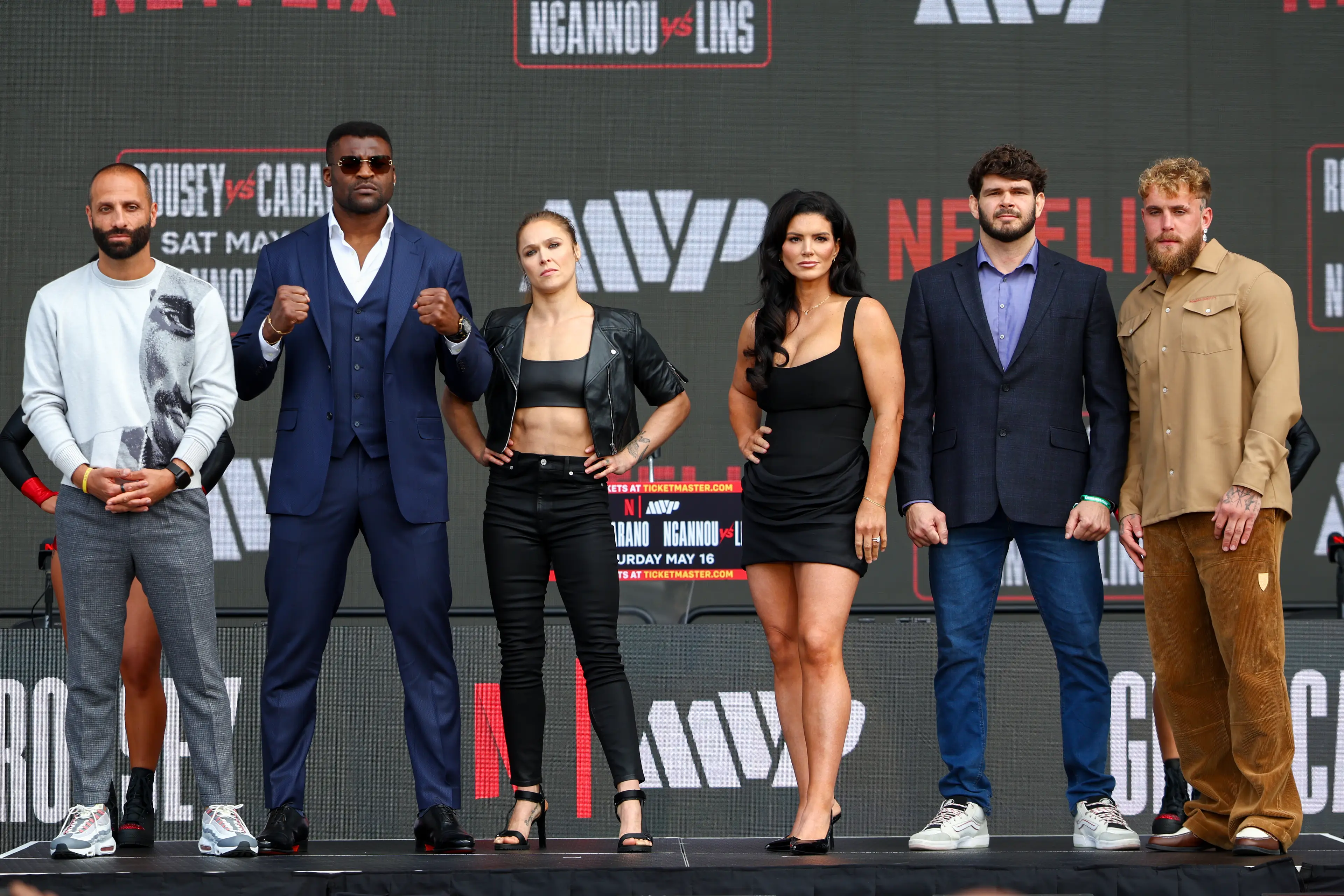 Nakisa Bidarian, Francis Ngannou, Ronda Rousey, Gina Carano, Philipe Lins, and Jake Paul pose onstage during Netflix's Ronda Rousey x Gina Carano (Getty Images)