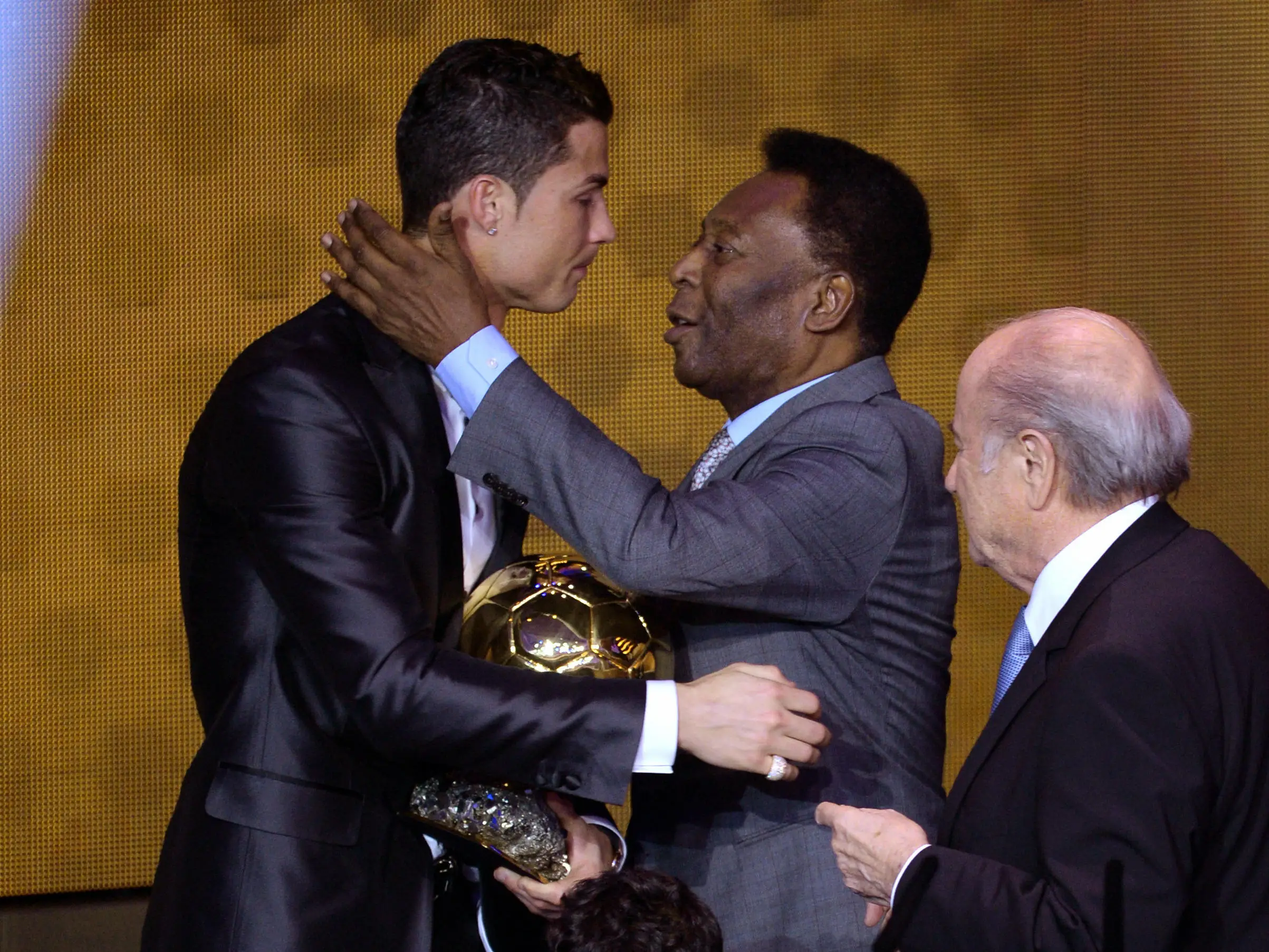 Cristiano Ronaldo and Pele embrace during the Ballon d'Or ceremony in 2014. Image: Alamy