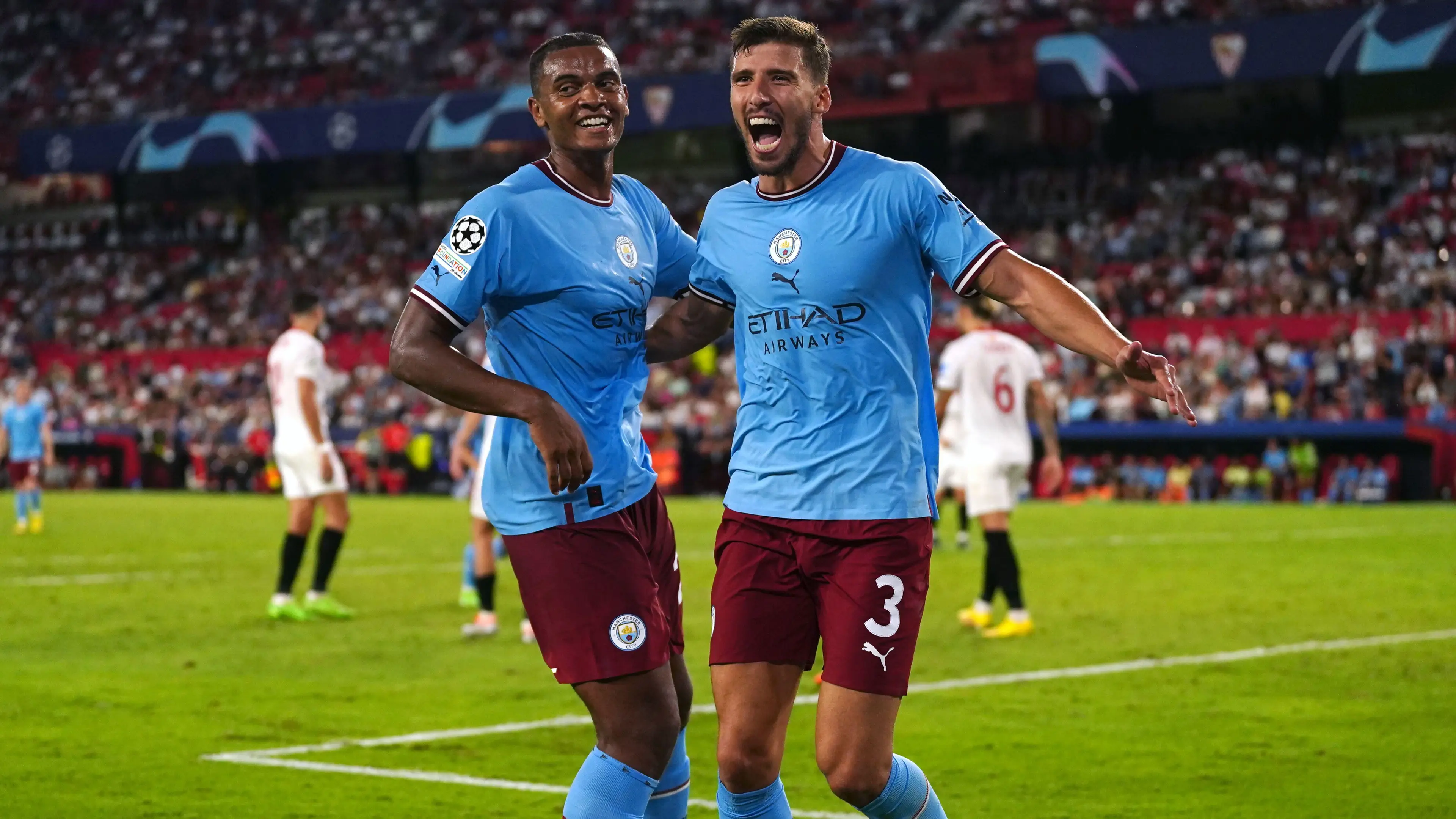 Ruben Dias celebrates with Manuel Akanji after scoring against Sevilla in the Champions League (PA Images/Alamy)