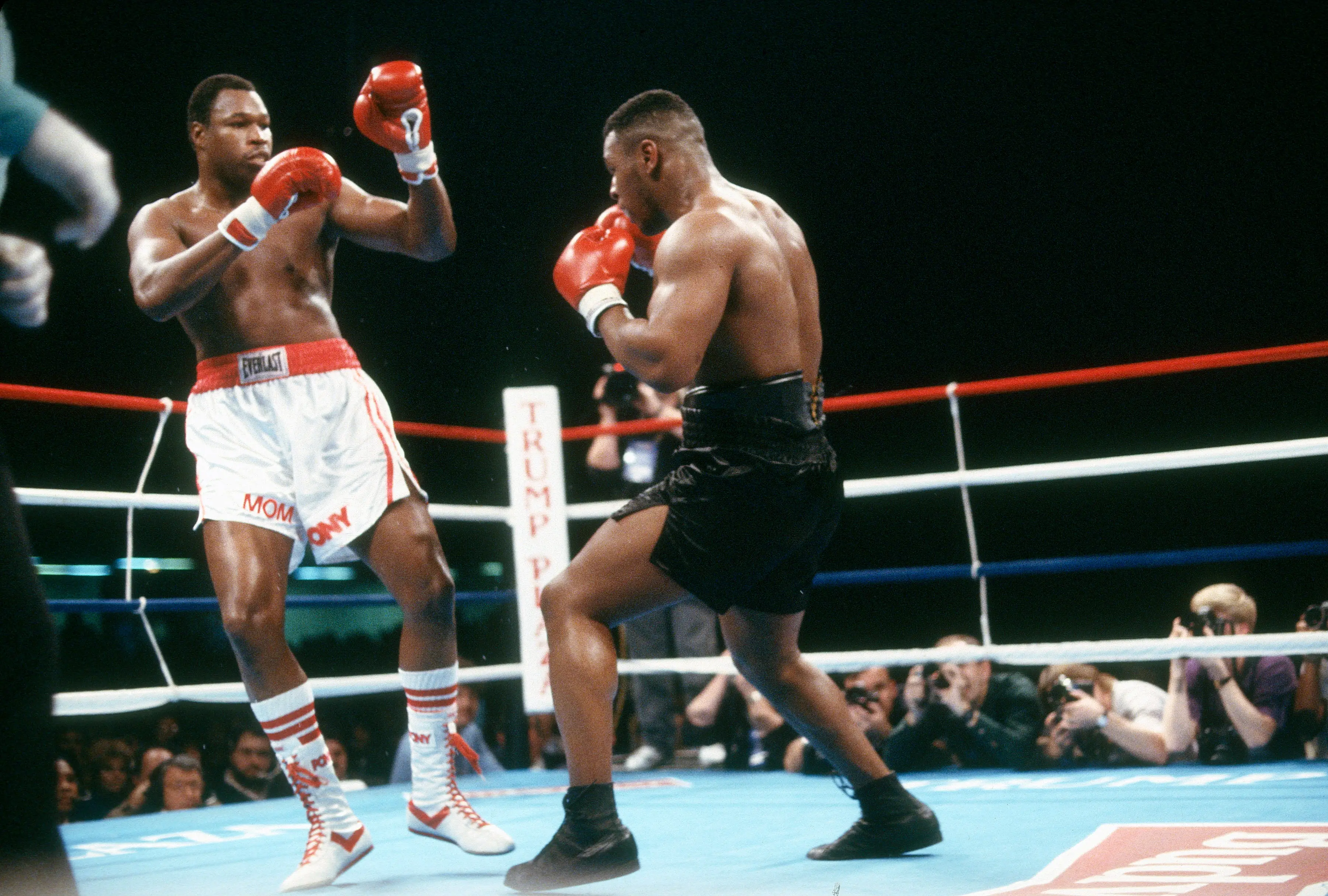 Larry Holmes and Mike Tyson fight for the WBA, WBC and IBF heavyweight tittle on January 22, 1988. Image credit: Getty