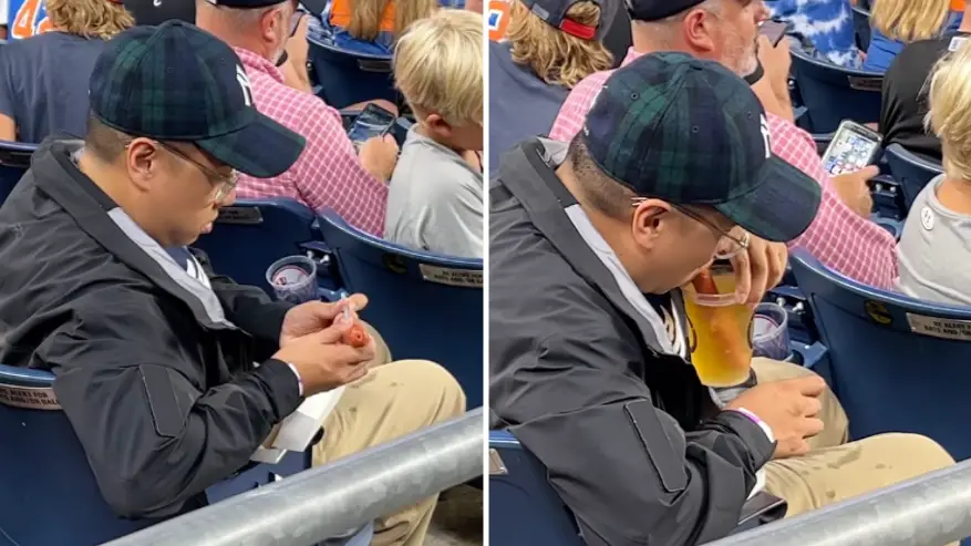 American sports fan goes viral for making a hot dog straw to suck up his beer