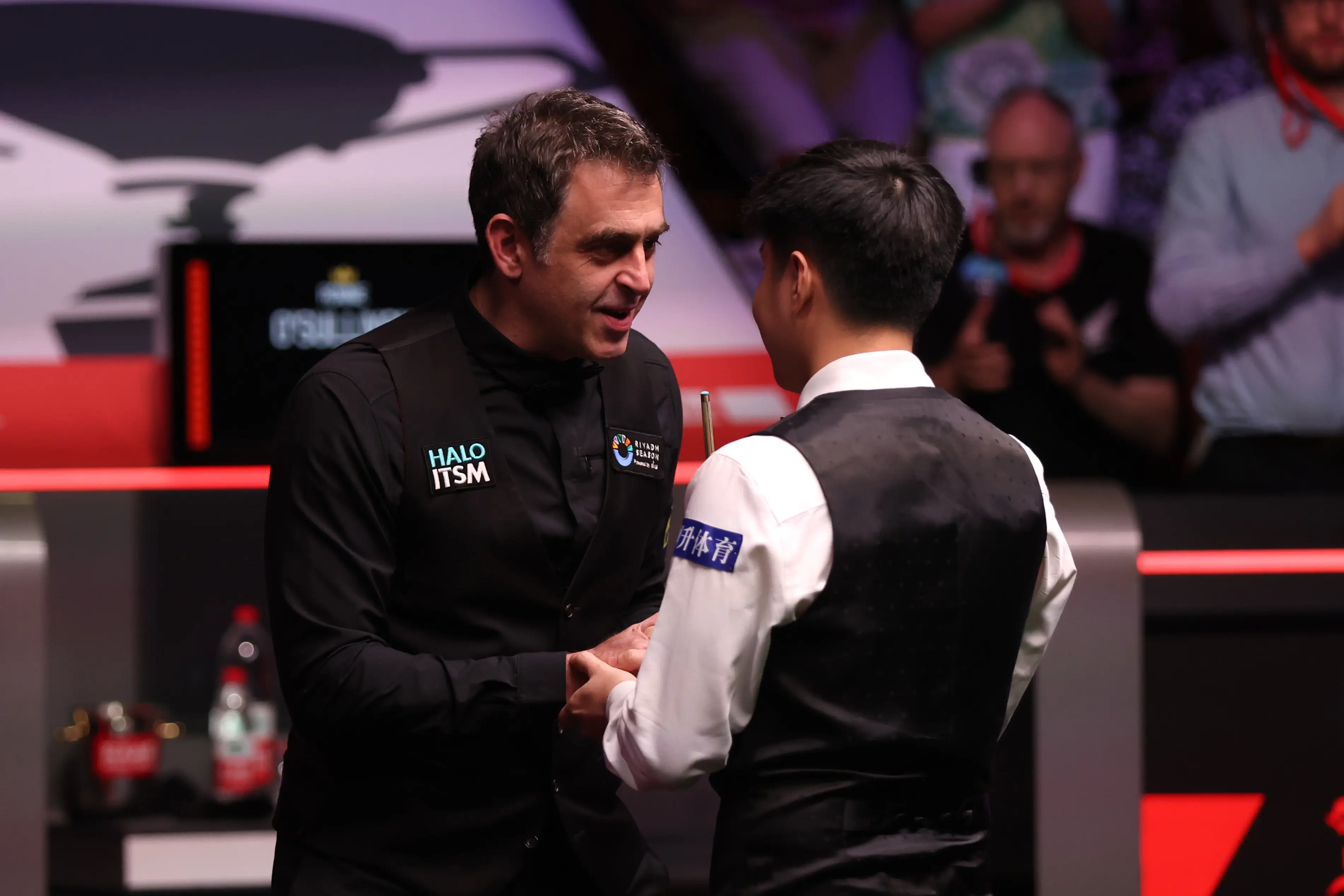 Ronnie O'Sullivan and Zhao Xintong shared a warm embrace following the match (Image: Getty)