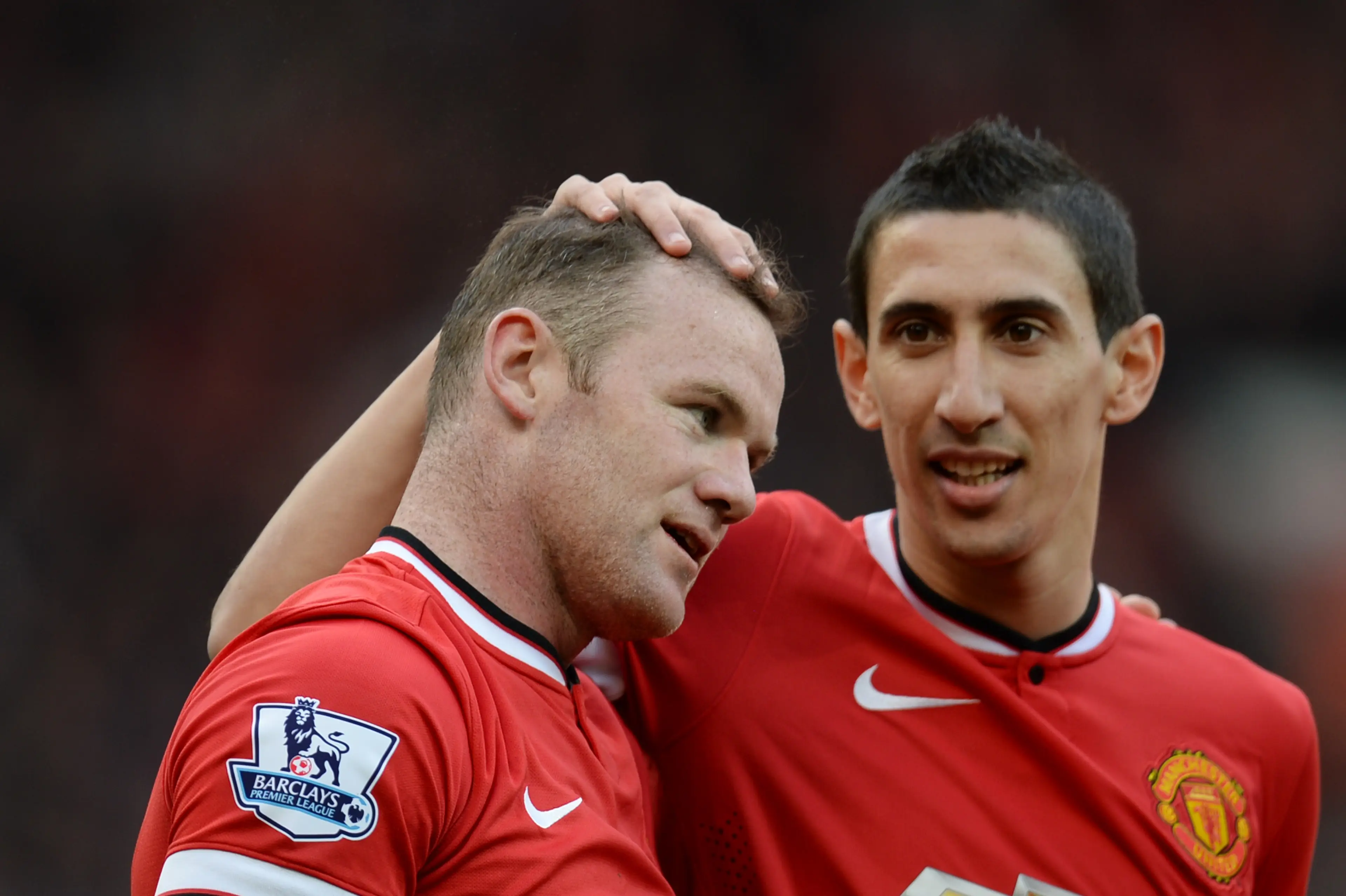 Wayne Rooney is congratulated by Angel Di Maria while playing for Manchester United (Image: Getty)