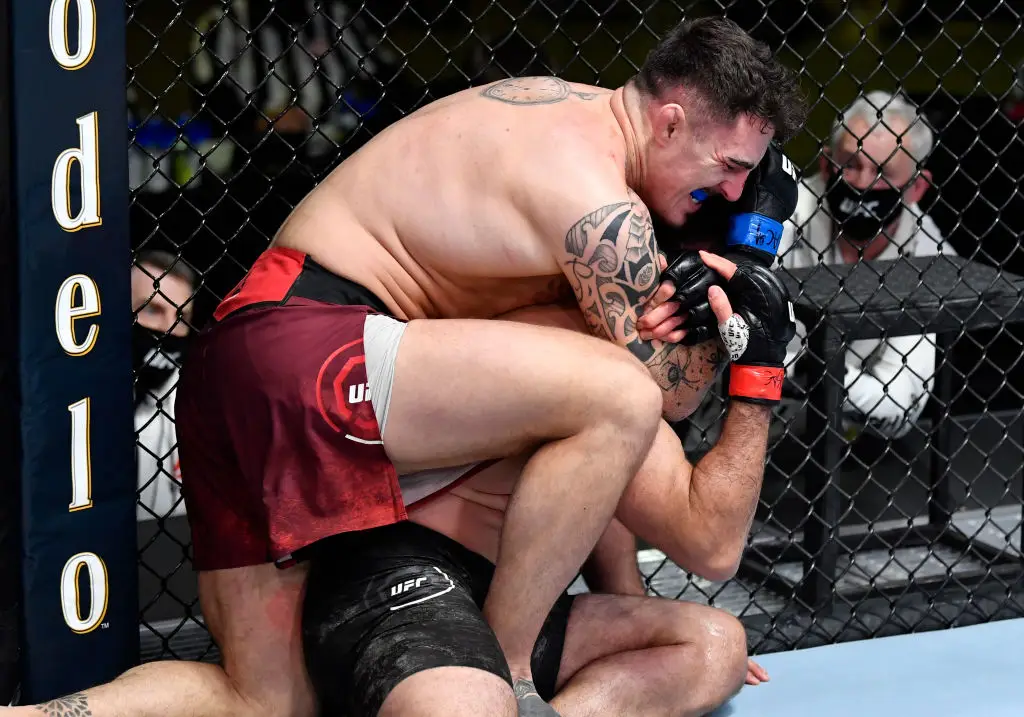 Tom Aspinall defeated Andre Arlovski via Rear Naked Choke in the second round of their fight in 2021. (Image: Getty)