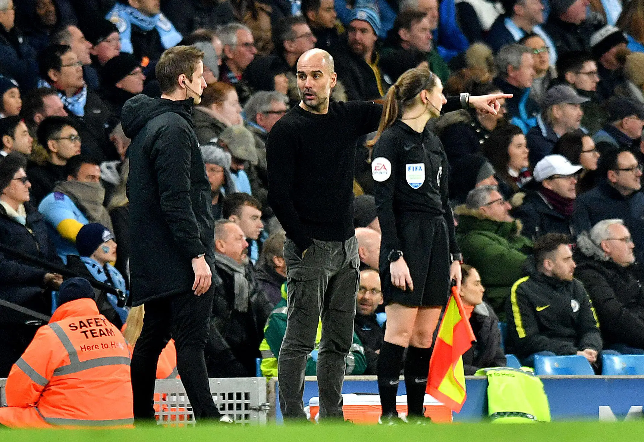John Brooks speaks with Pep Guardiola. PA Images / Alamy