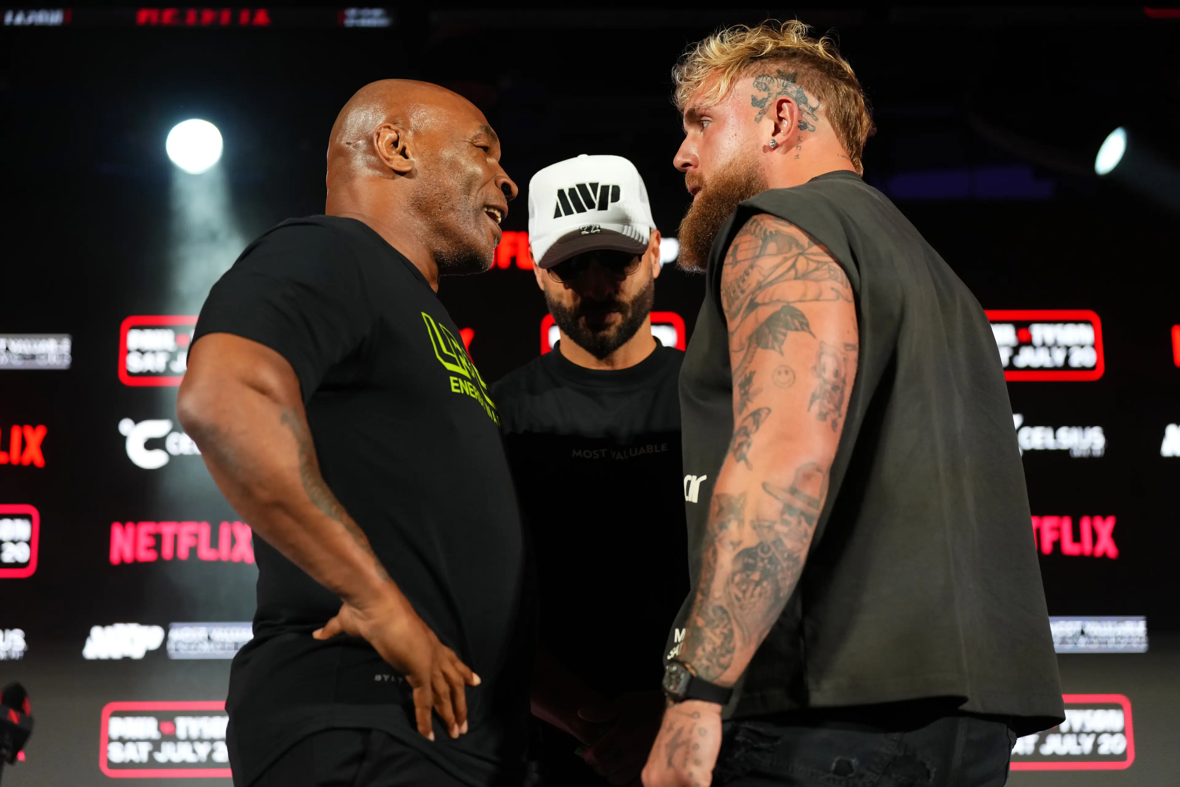 Mike Tyson faces off against Jake Paul in a pre-fight press conference. Image: Getty