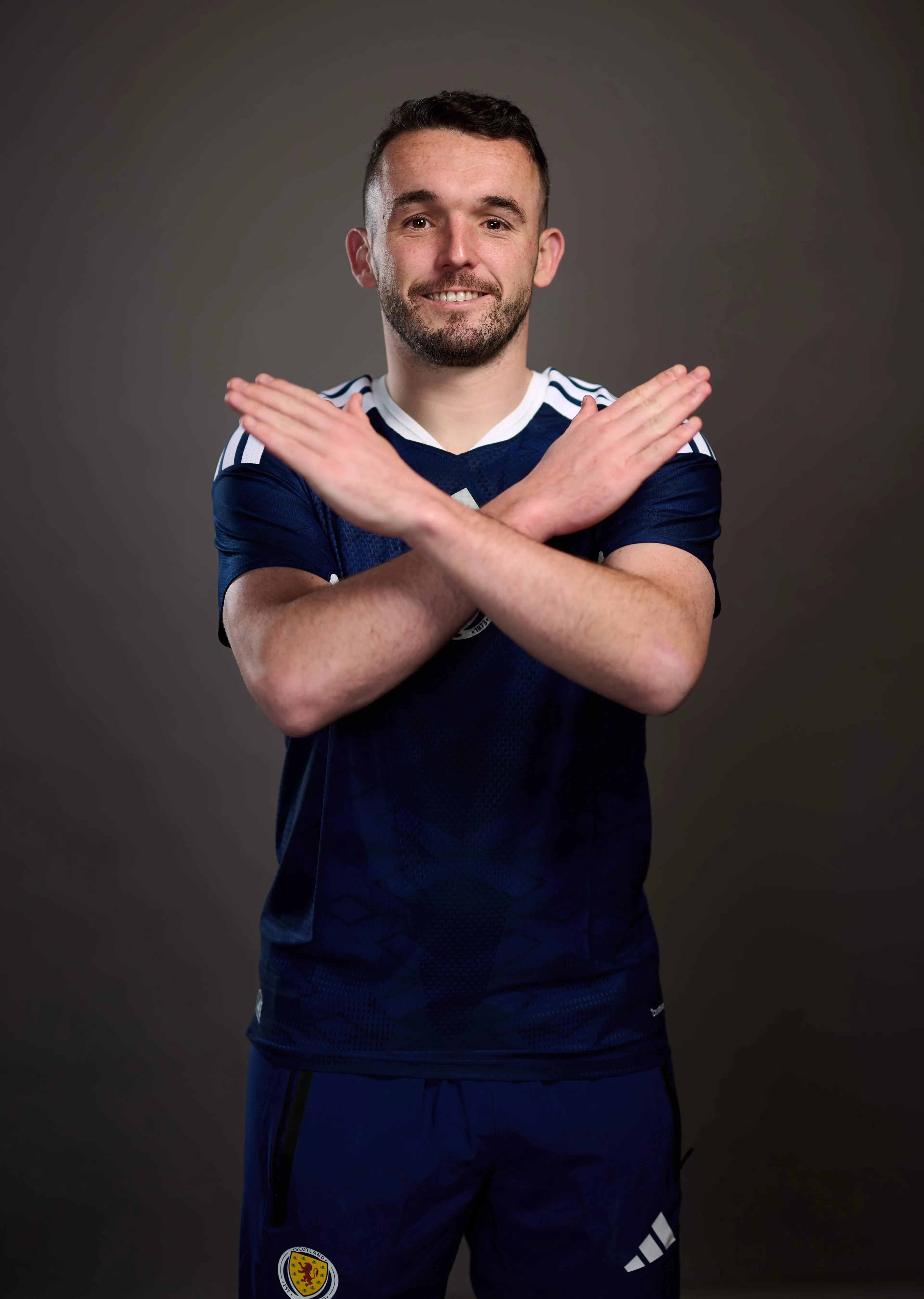McGinn performed the 'X' gesture in a photoshoot. Image: Getty
