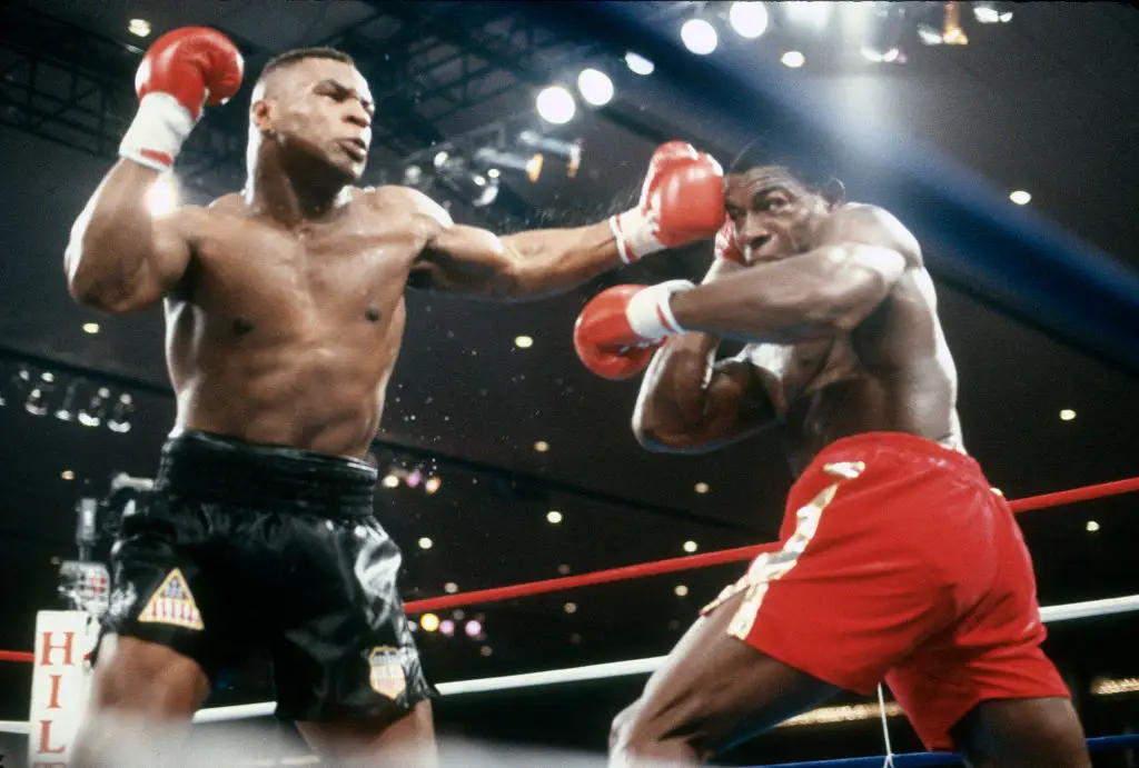 Mike Tyson and Frank Bruno faced each other in the ring on two occasions. (Image: Getty) 