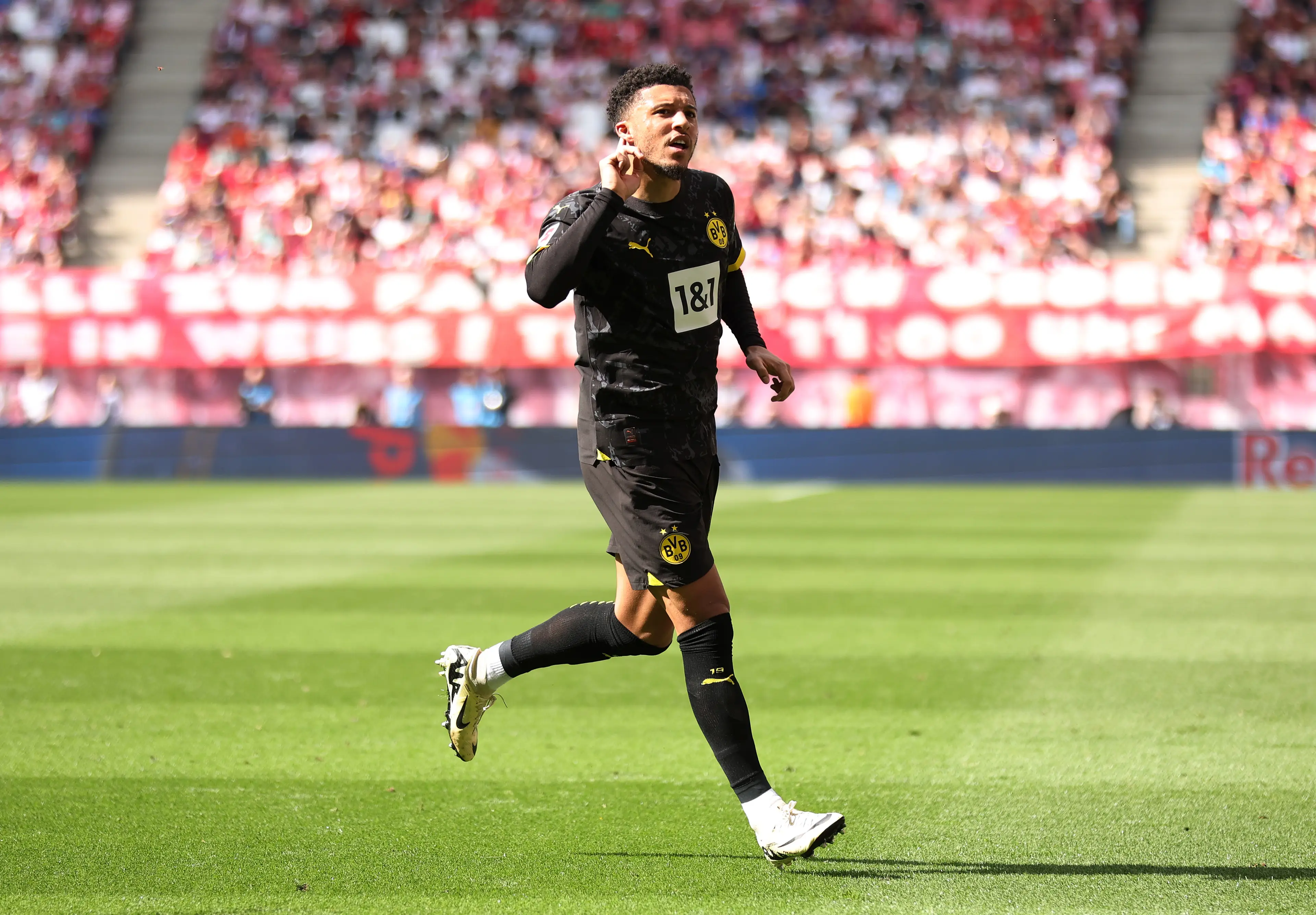 Jadon Sancho celebrates scoring a goal for Borussia Dortmund. Image: Getty