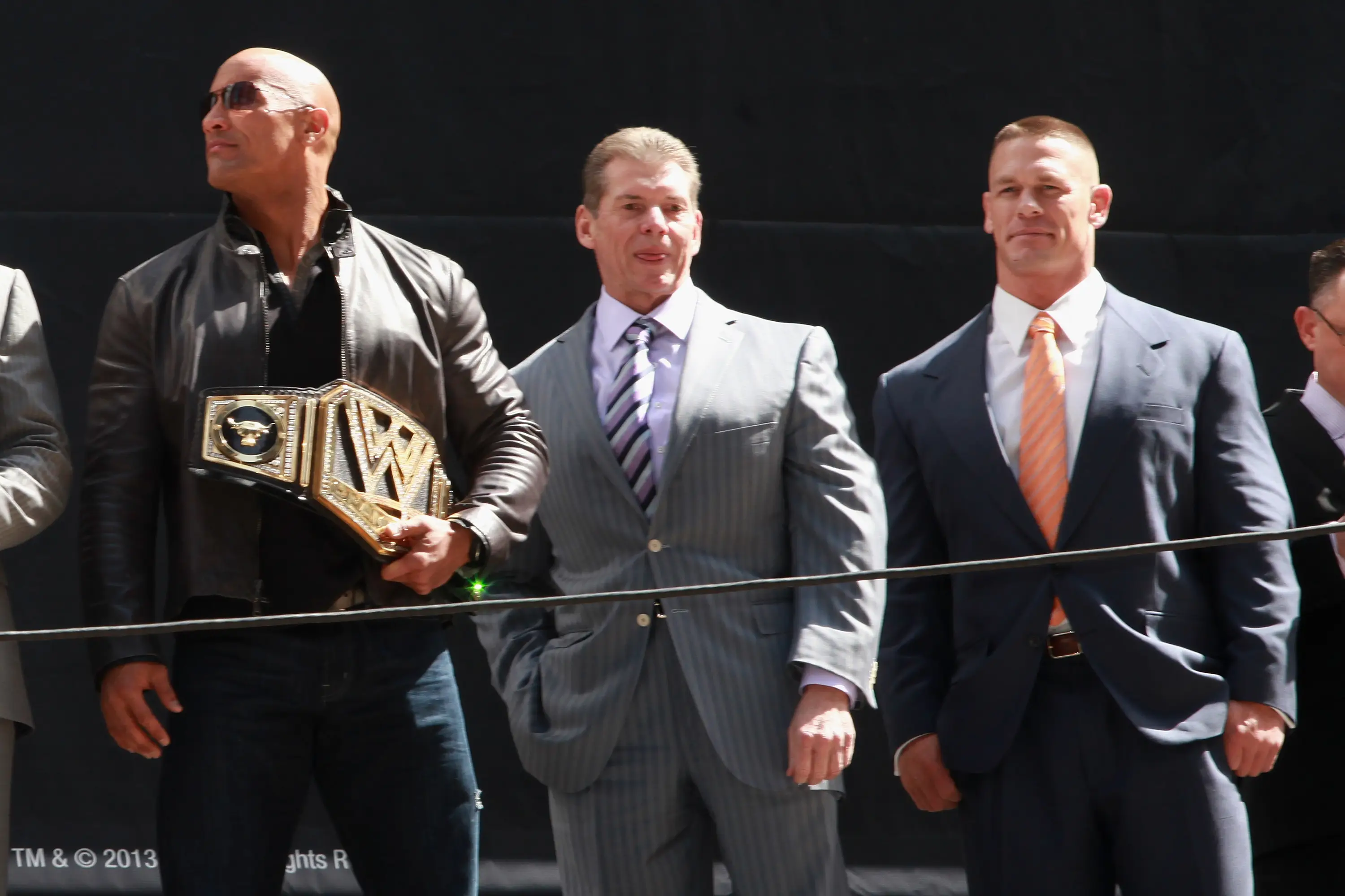 The Rock, Vince McMahon and John Cena. (Image: Getty)