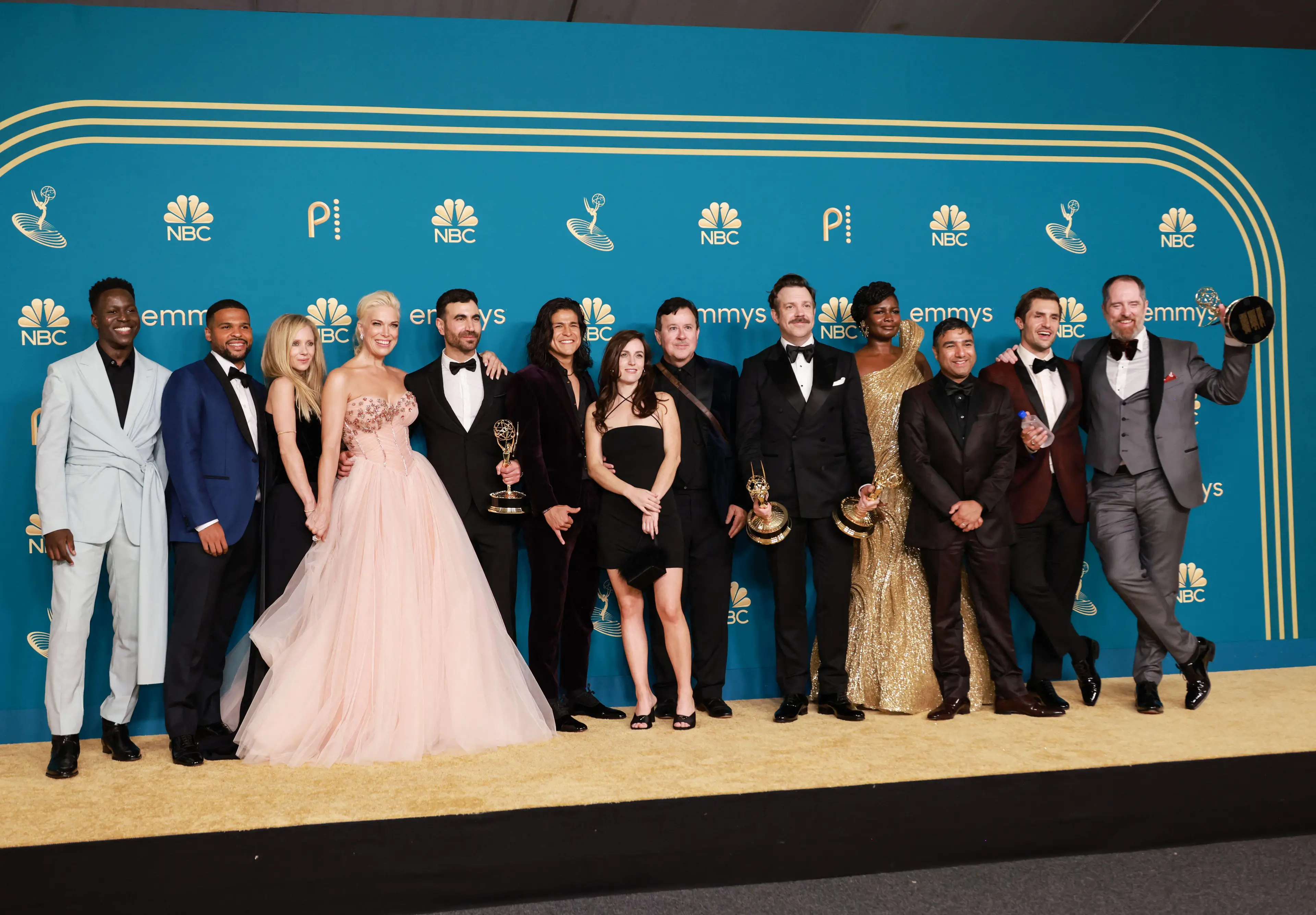 Lasso and the team celebrate their Emmy wins. Image: Alamy