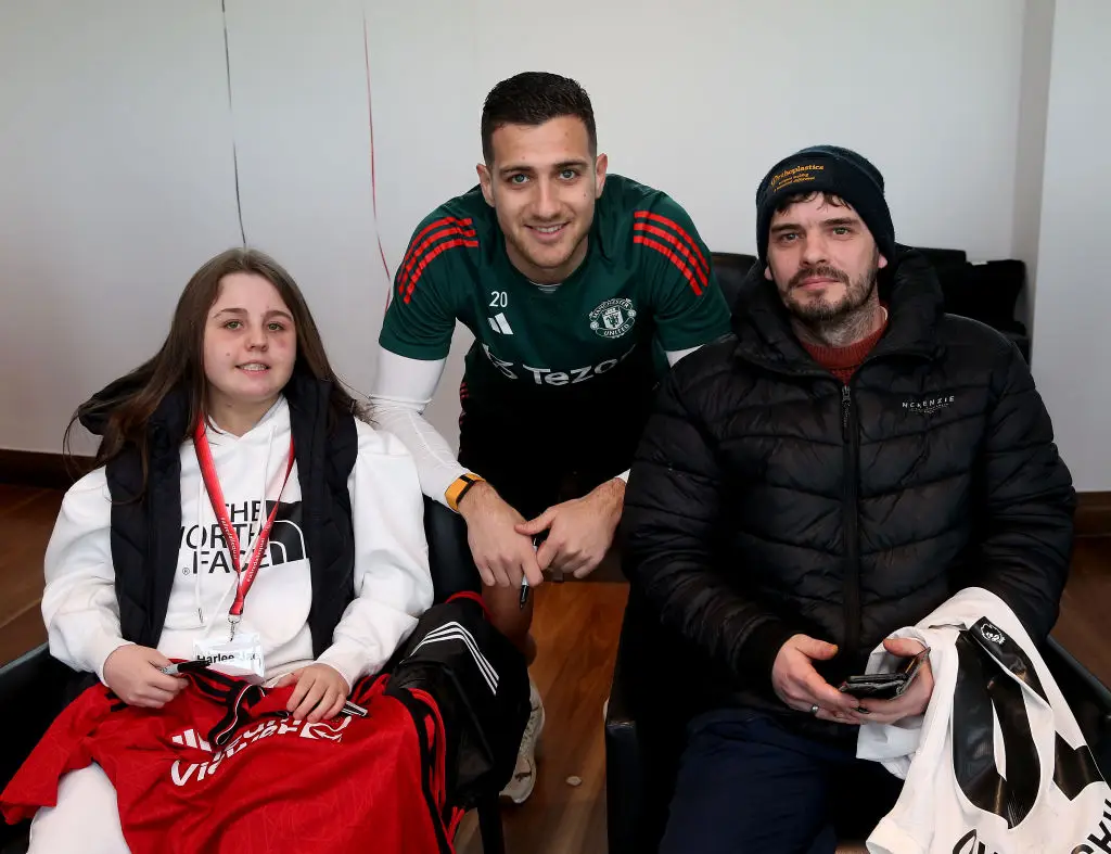Man Utd defender Diogo Dalot pictured with two fans at one of the Foundation's 'Dream Days' (Image: Getty)