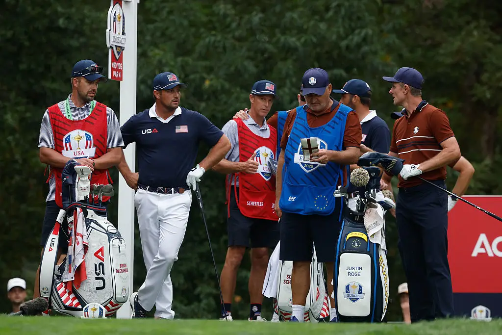 Bryson DeChambeau (second from left), caddie Greg Bodine (left) and Justin Rose (right) pictured during the second day of the Ryder Cup (Image: Getty)