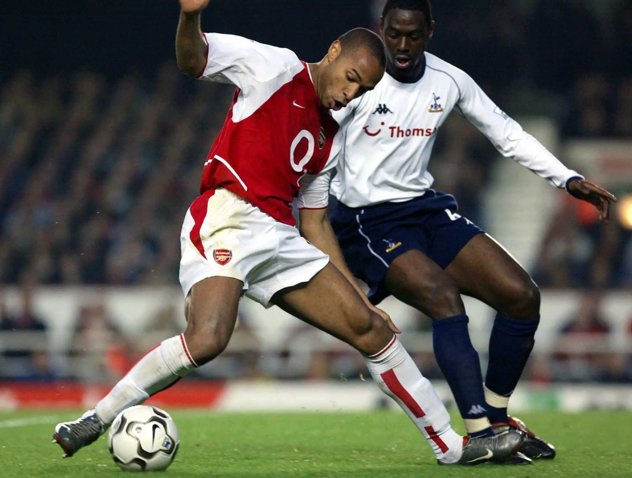 Thierry Henry and Ledley King during a Premier League game. Image: Getty 